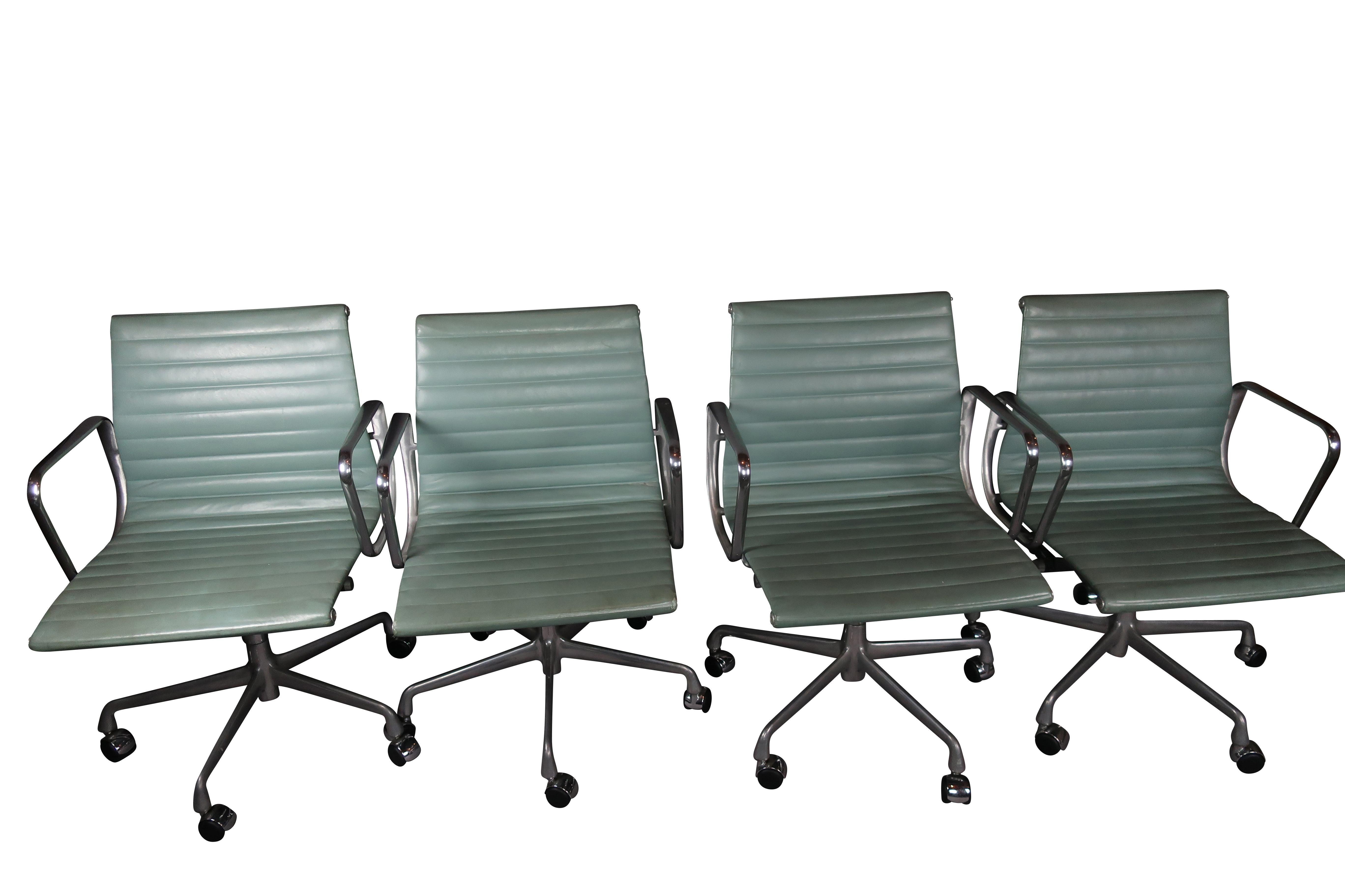 Vintage Eames Group Management Chairs Eames with Pneumatic lift four Seafoam egg blue leather, originally purchased through design within reach.