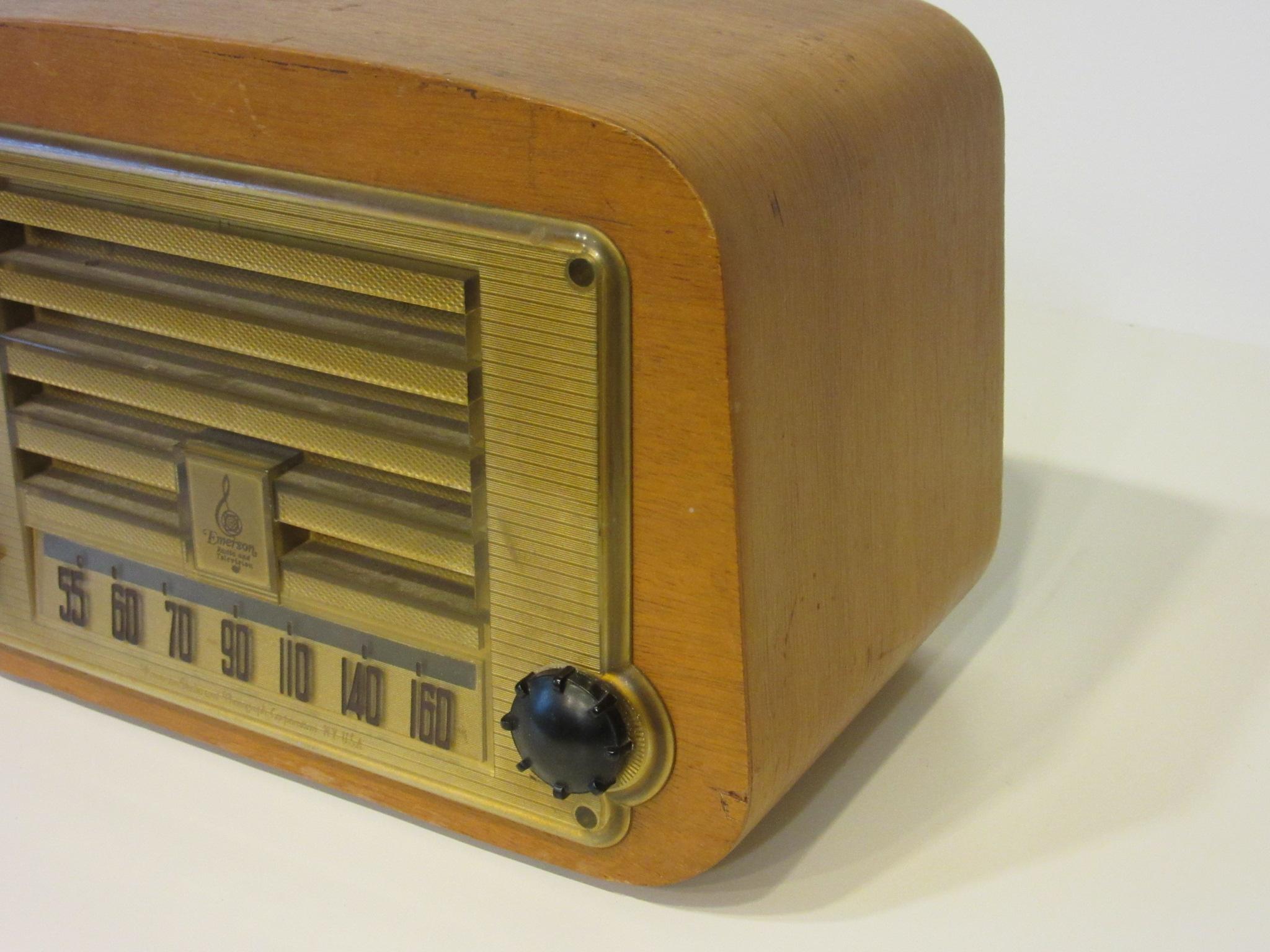 A Emerson AM radio with case designed by Charles and Ray Eames using their bent molded plywood technique discovered during the war years. The cases were constructed by the Evans Products Company with the radio internals made by the Emerson Radio and