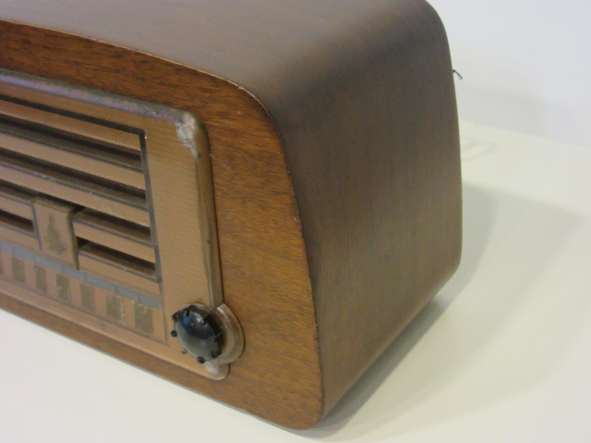A Emerson AM radio with the case designed by Charles and Ray Eames using their bent molded plywood technique discovered during the war years and transferred over to commercial items. The cases were manufactured by the Evans Products Company and the