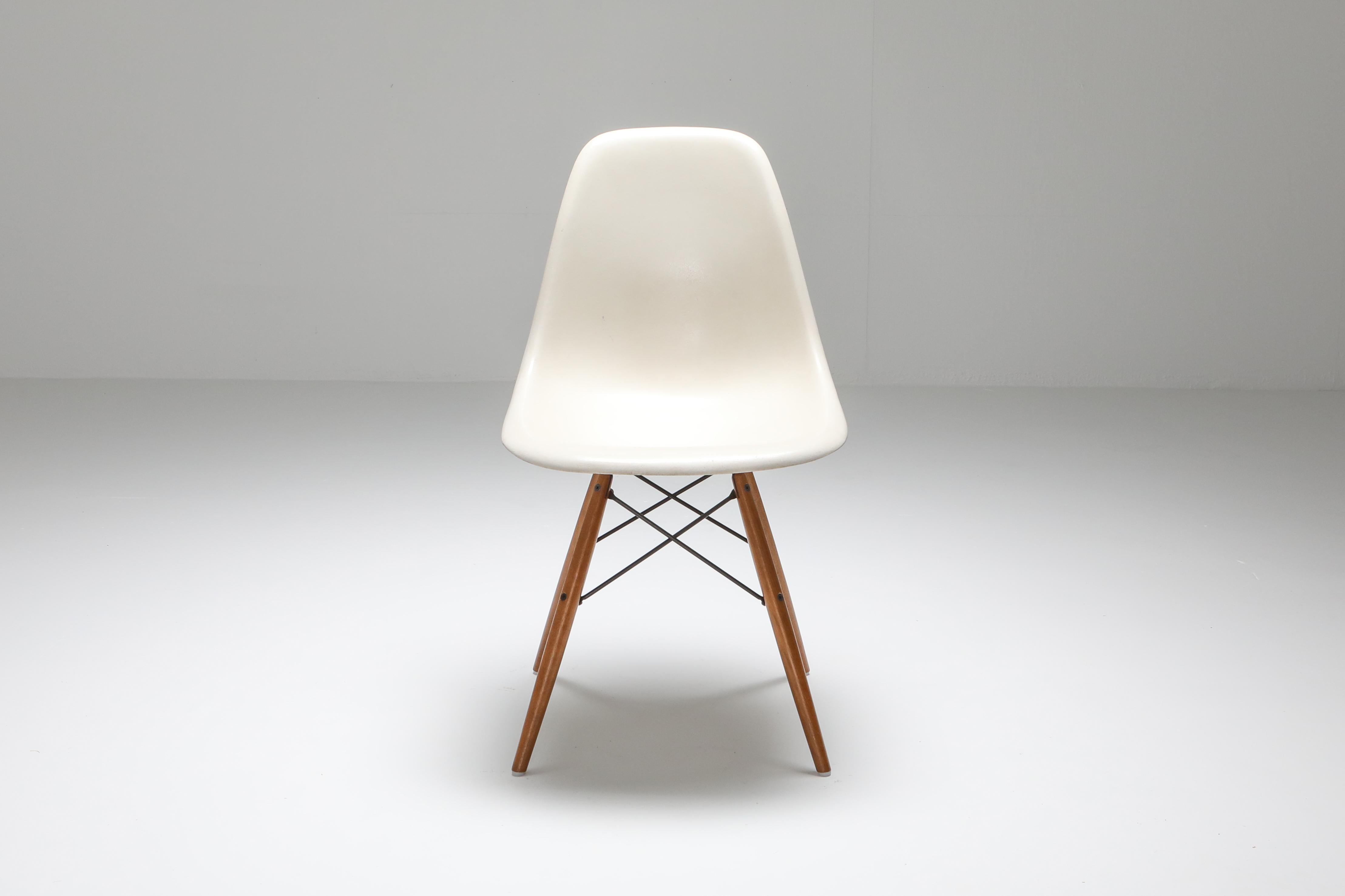 Charles and Ray Eames DSW chair for Herman Miller

white fibreglass shell
walnut and black steel base.