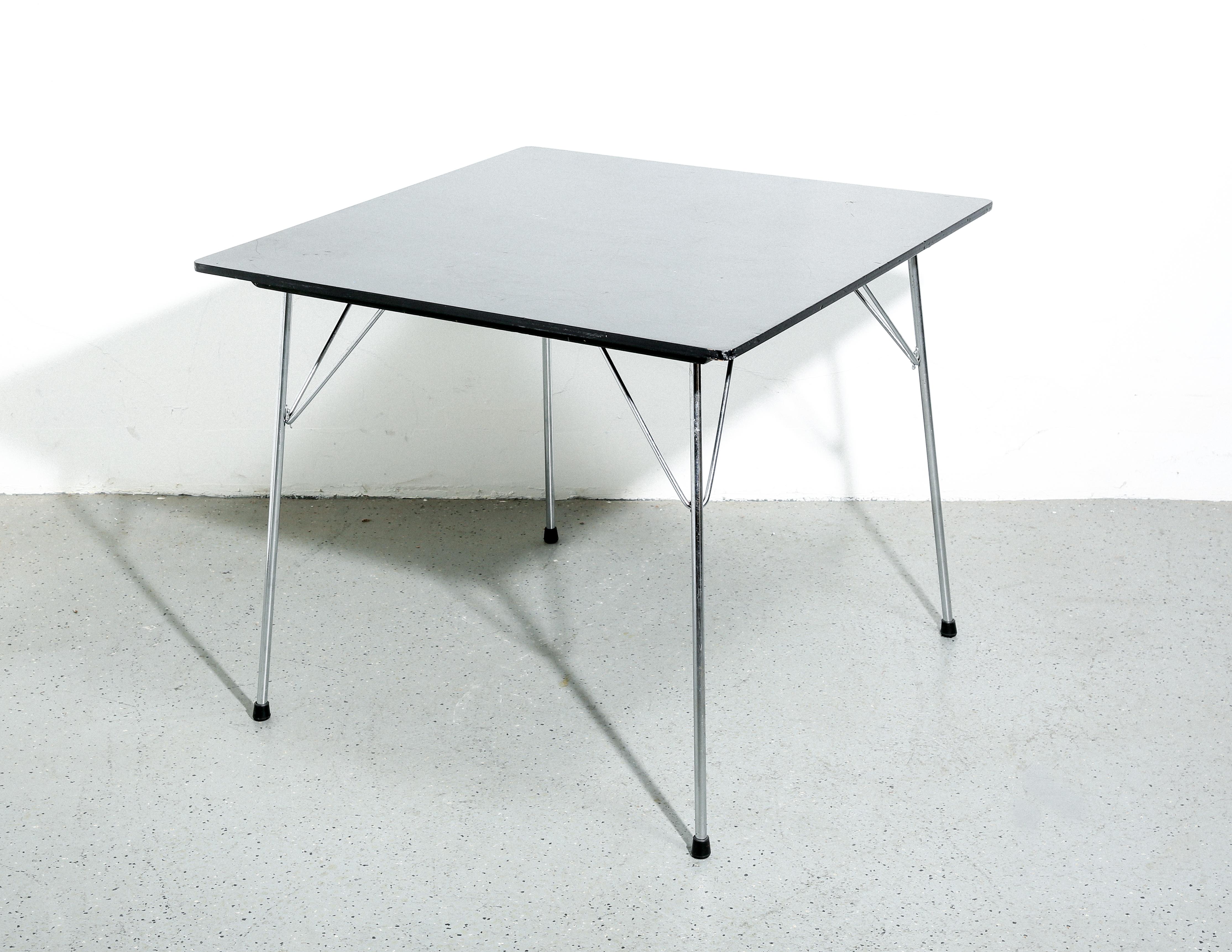 The Eames DTM-2 (Dining Table Metal) table is a classic example of mid-century modern design, reflecting the simple yet sophisticated aesthetic of its creators, Charles and Ray Eames. Introduced in the 1950s, this table was designed to be practical