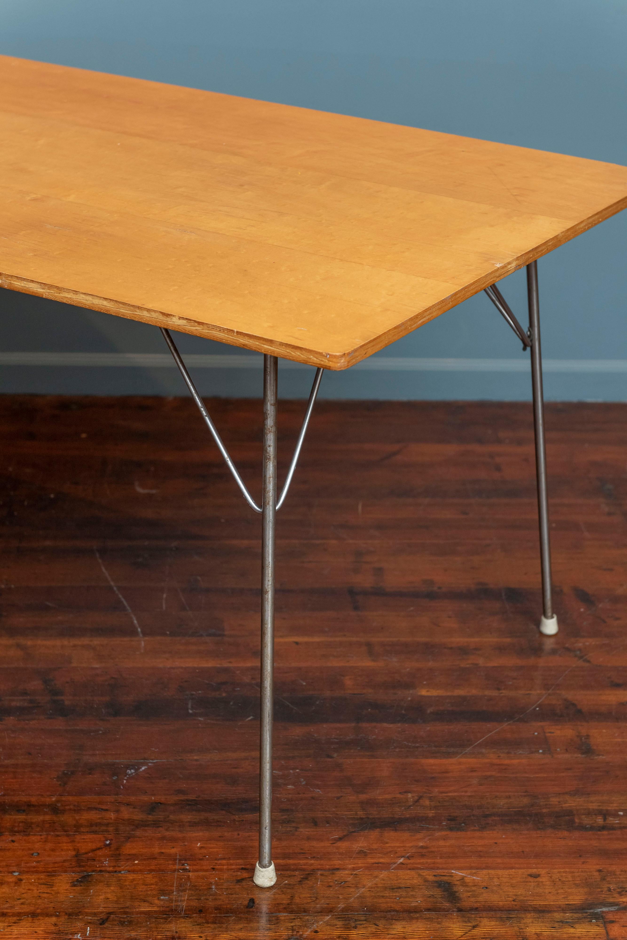 Eames DTM table, early example made from birch veneer plywood with steel folding legs. This is a rare piece of Mid-Century Modern design that is a survivor not a pristine museum quality example. It would make a great addition to your Eames