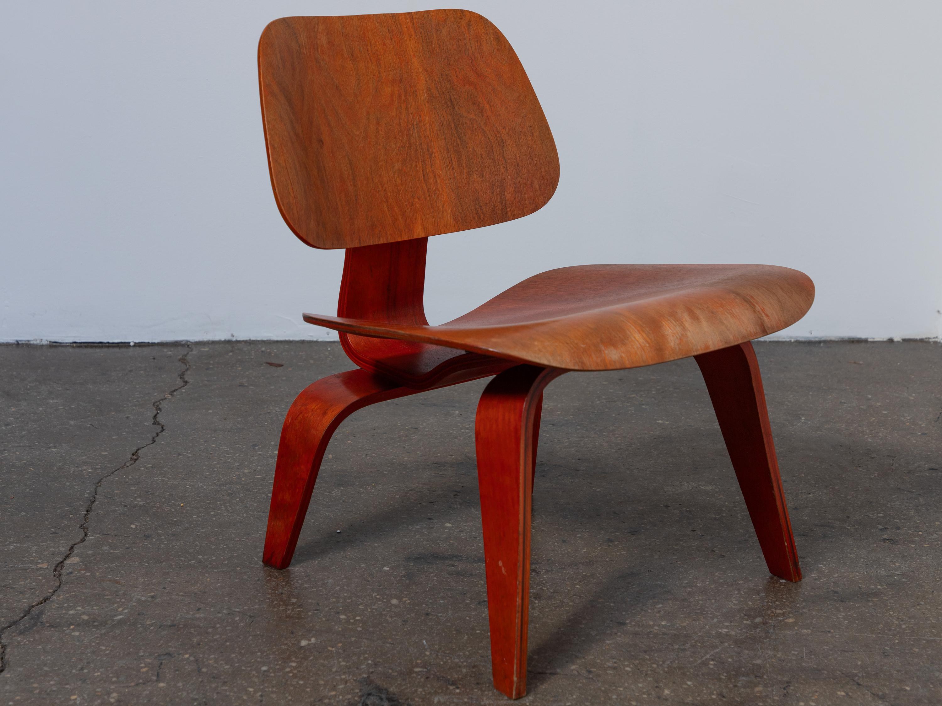 Eames Evans Red Aniline Dye LCW Lounge Chairs - Matched Pair   In Good Condition For Sale In Brooklyn, NY