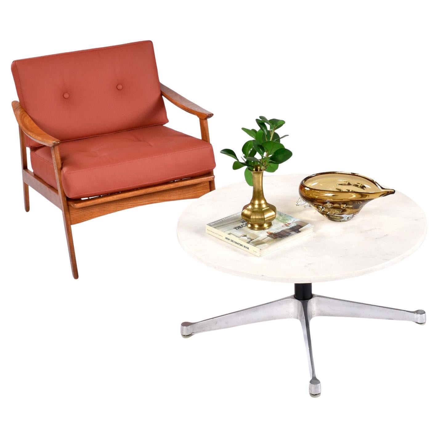 This listing is for the coffee table alone. The chair and accessories pictured are not included. 

Vintage Eames white marble coffee table for Herman Miller. The 32″ diameter coffee table rests on a classic Charles Eames aluminum contract base with