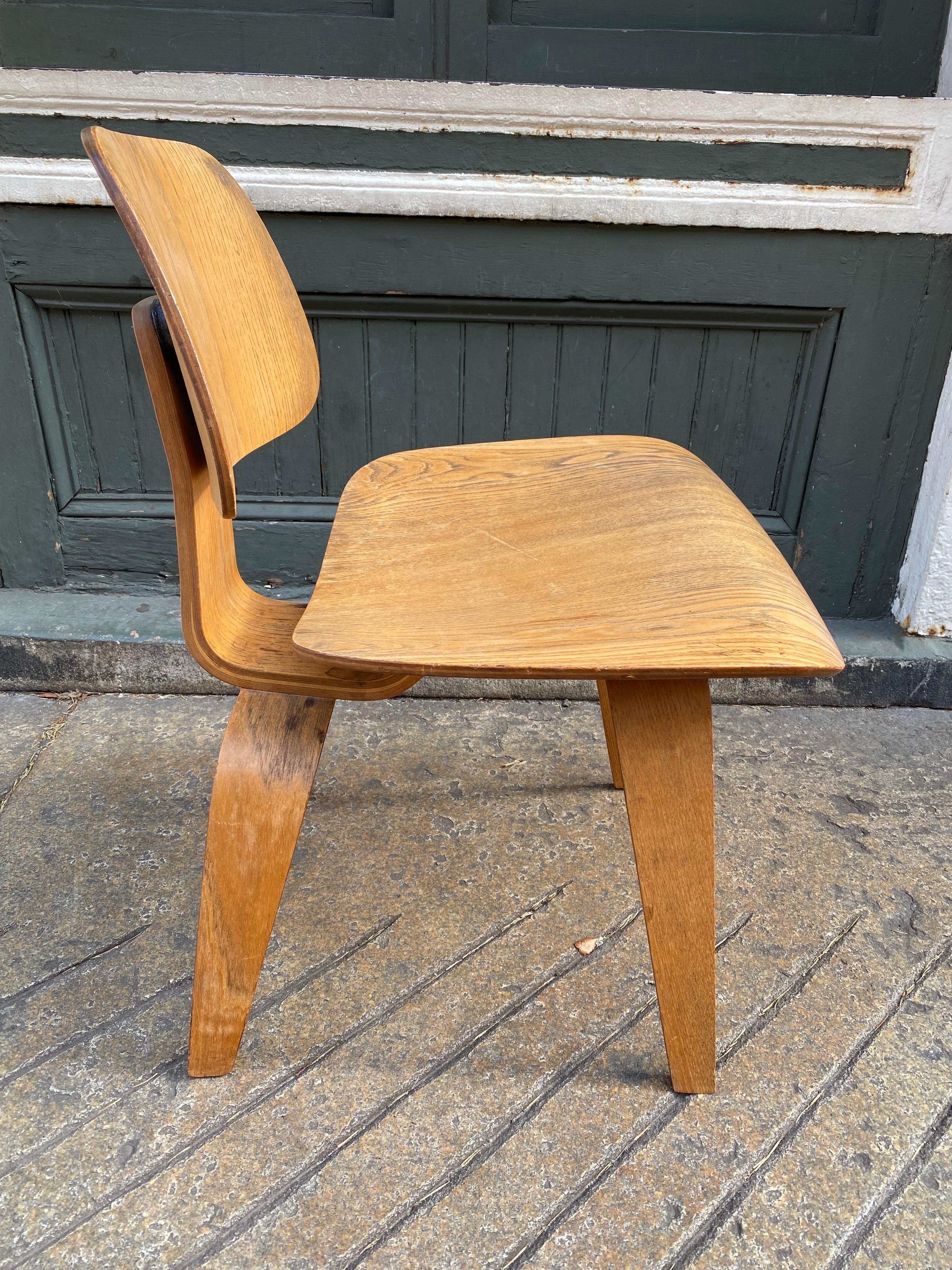Eames for Herman Miller Ash DCW. Bought from the original owners! Chair presents well with glue showing on back where seat back was reattached at some point. Wood is nice with no veneer damage! Wood shows normal wear from use. Overall clean example!