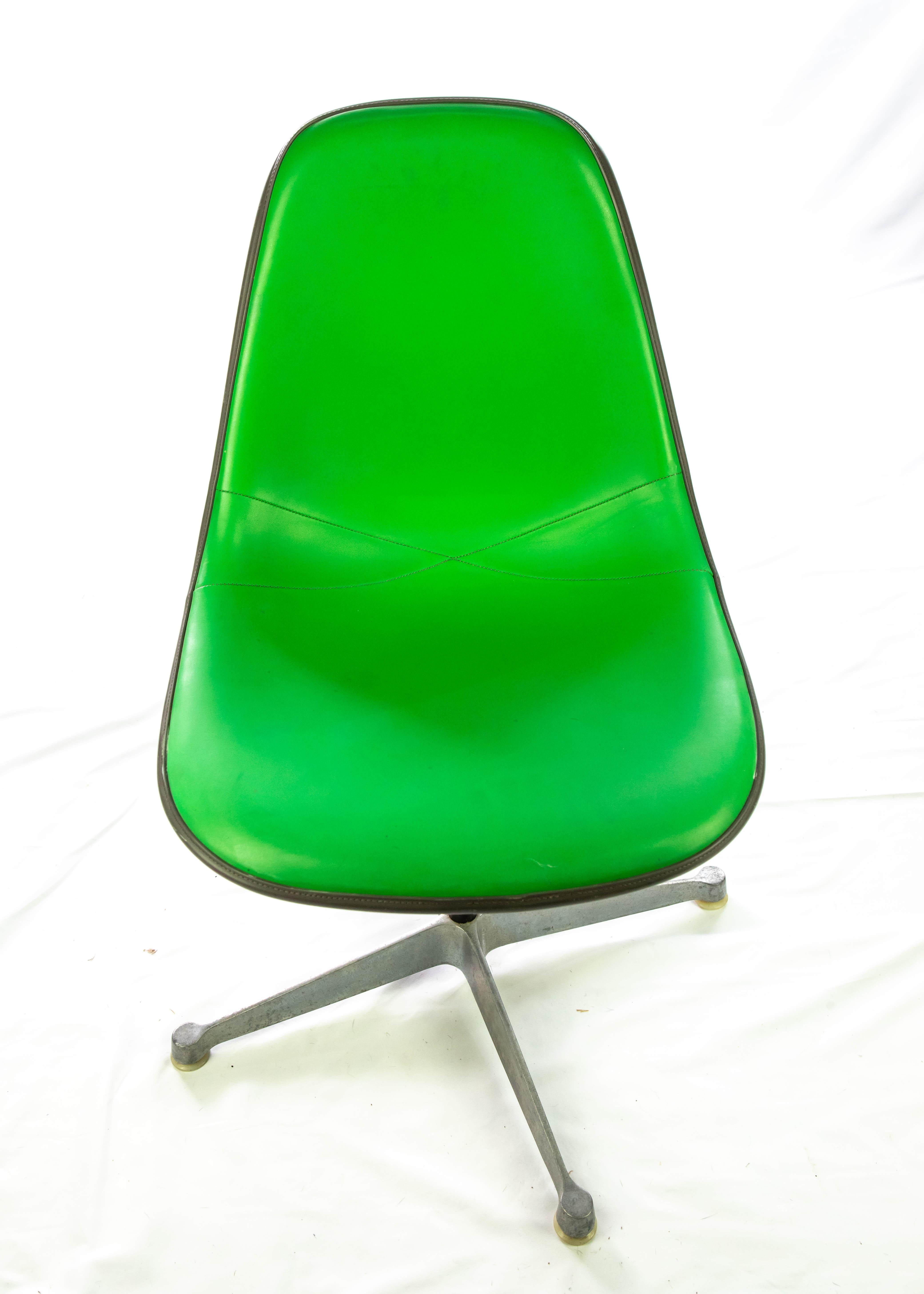 Offering these stunning Eames fiberglass upholstered swivel chairs. This bright green will not disappoint and they will be the talk of any room they are in! The condition of these are great, very slight scuff marks to the grey cording around the