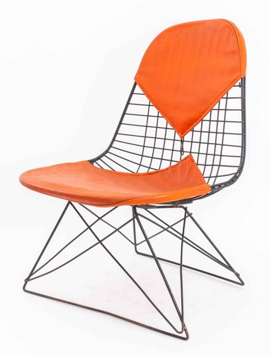 Charles Eames (American, 1907-1978) for Herman Miller DKR Bikini black wire chairs with low cat's cradle base, with original orange vinyl covering. 26