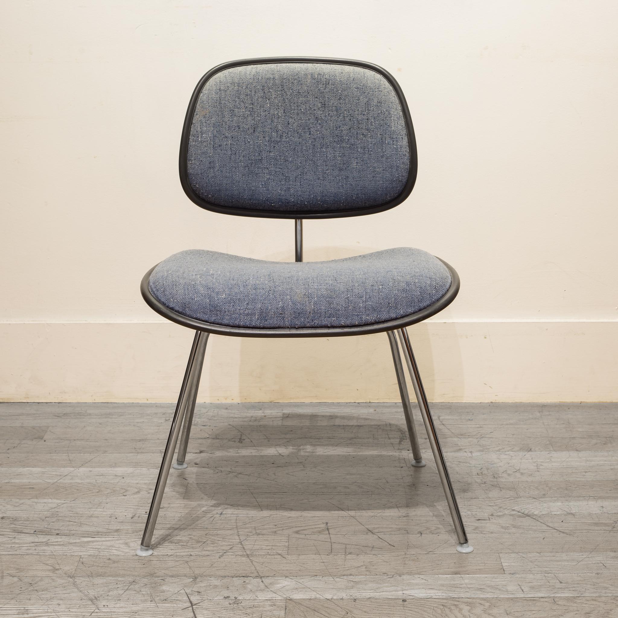 About

A EC-127 padded DCM chair by Charles Eames for Herman Miller. The padded seat and backrest are upholstered in light blue fabric with specs of dark blue and white. Grey vinyl piping with chrome plated frame and original Herman Miller