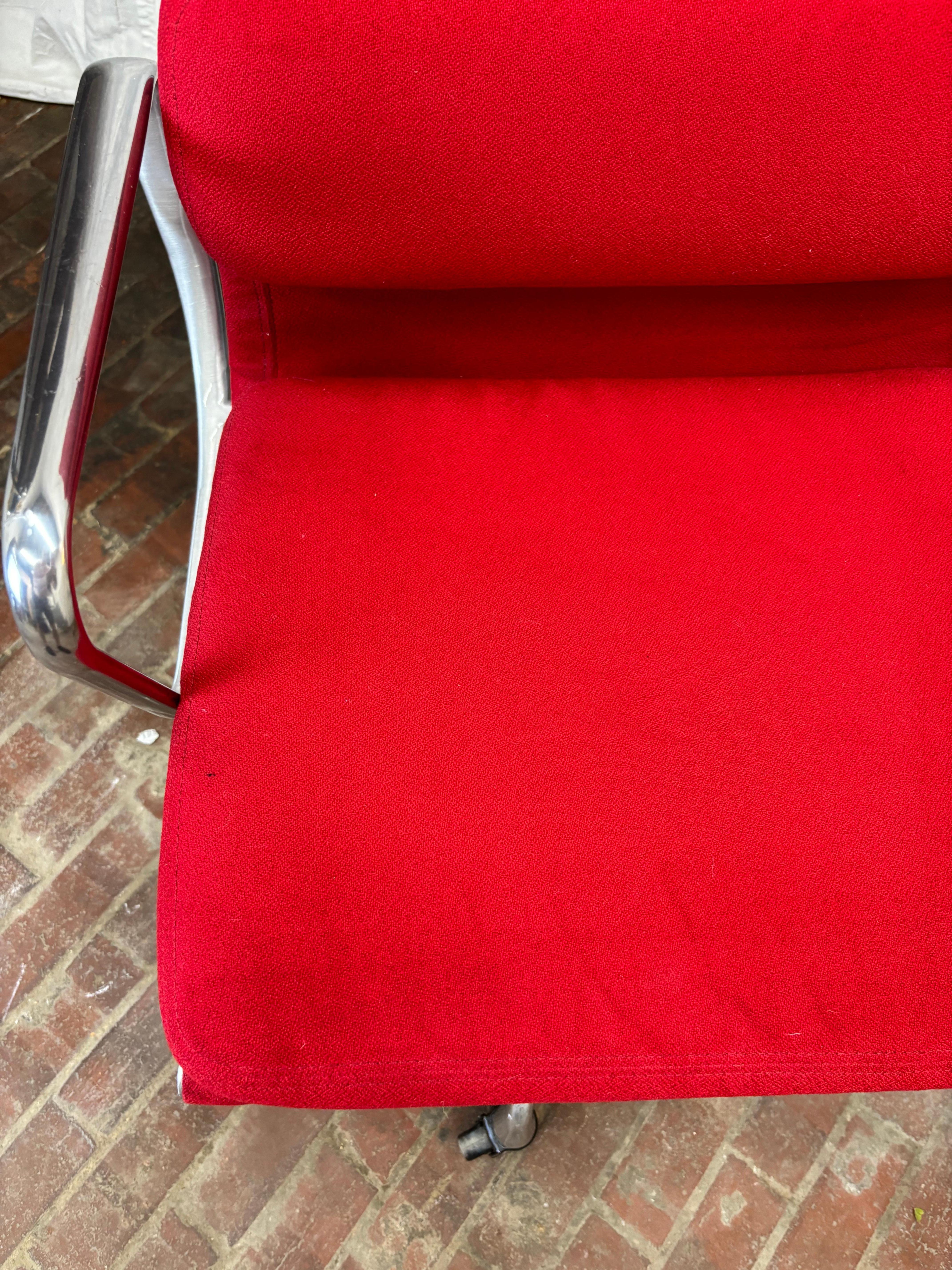 Executive Soft Pad Chair designed by Charles and ray Eames for Herman Miller.  These chairs are about 20 years old.  In very nice shape with little wear showing to the arms!  These were from a board room on the Main Line of Philadelphia!  Red fabric