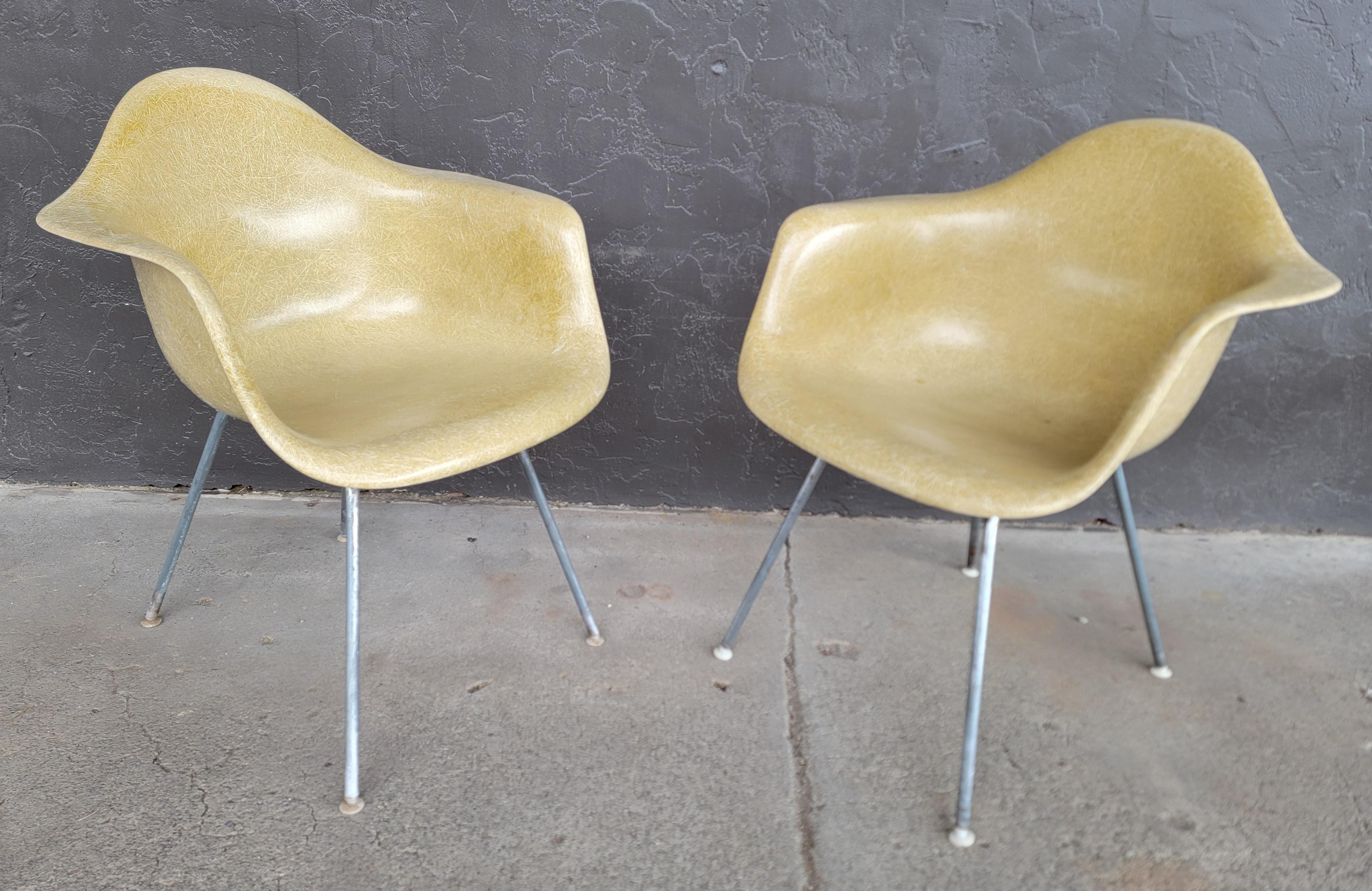 Good old pair of Charles and Ray Eames for Herman Miller formed fiberglass armchairs in Parchment color. Herman Miller marks on base indicating production dates to the 1960's. Original 