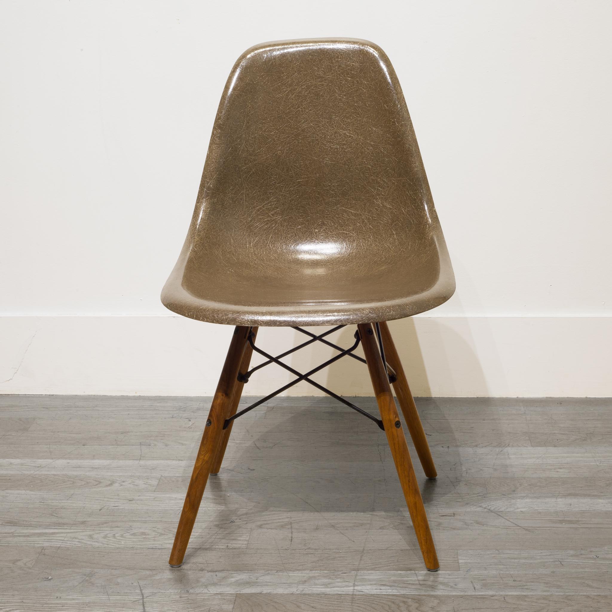 ABOUT

This is an original 1950s Eames fiberglass shell chair with original model sticker in Brown. This iconic chair is mounted on a newer Herman Miller Walnut dowel base. Replacements of the bases are common.

We have a total of 3 shell chairs