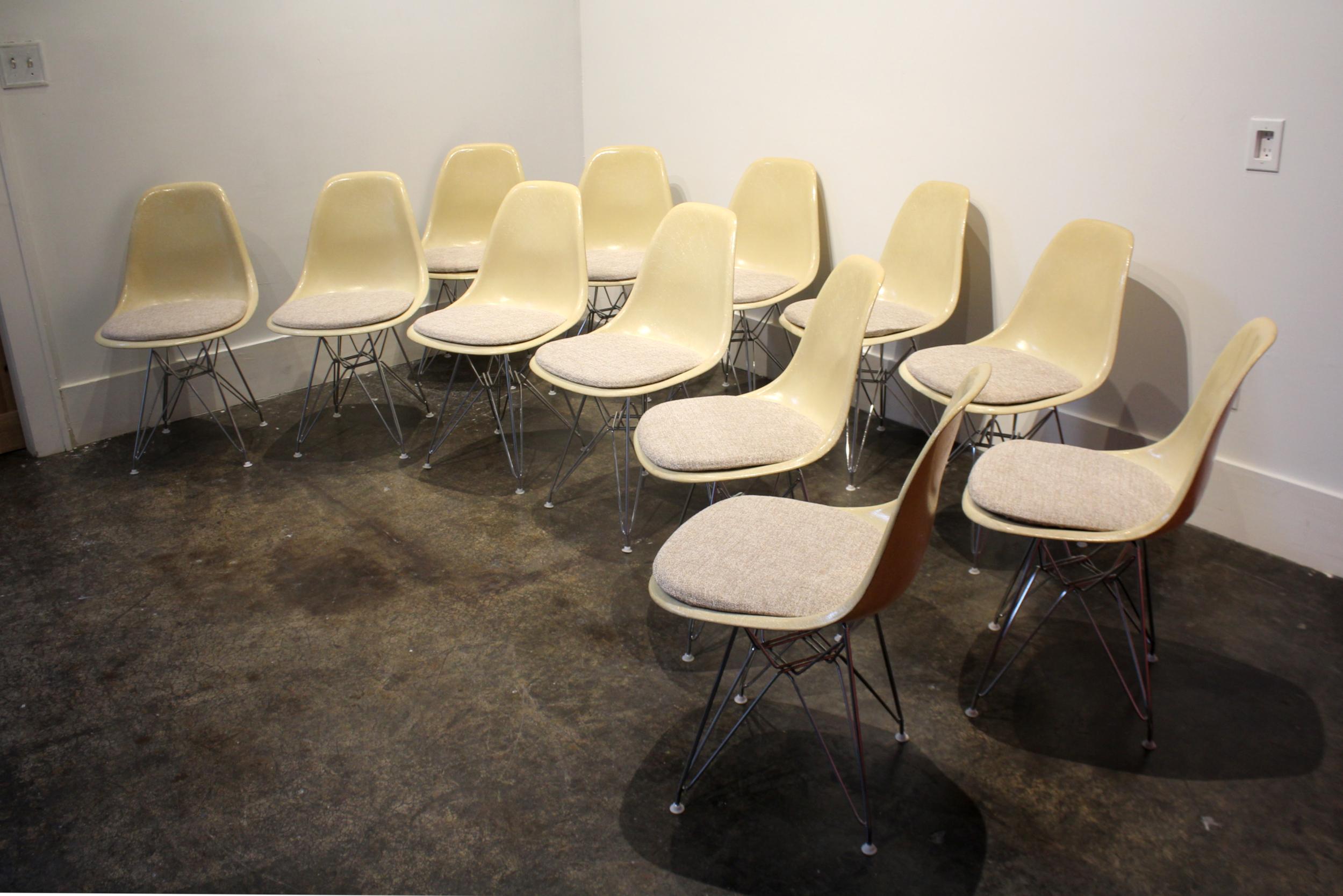 I have 12 vintage Eames for Herman Miller fiberglass side chairs, circa 1960. Newly reupholstered in elegant textured and blended weave of gray, tan, brown and gold. Steel 