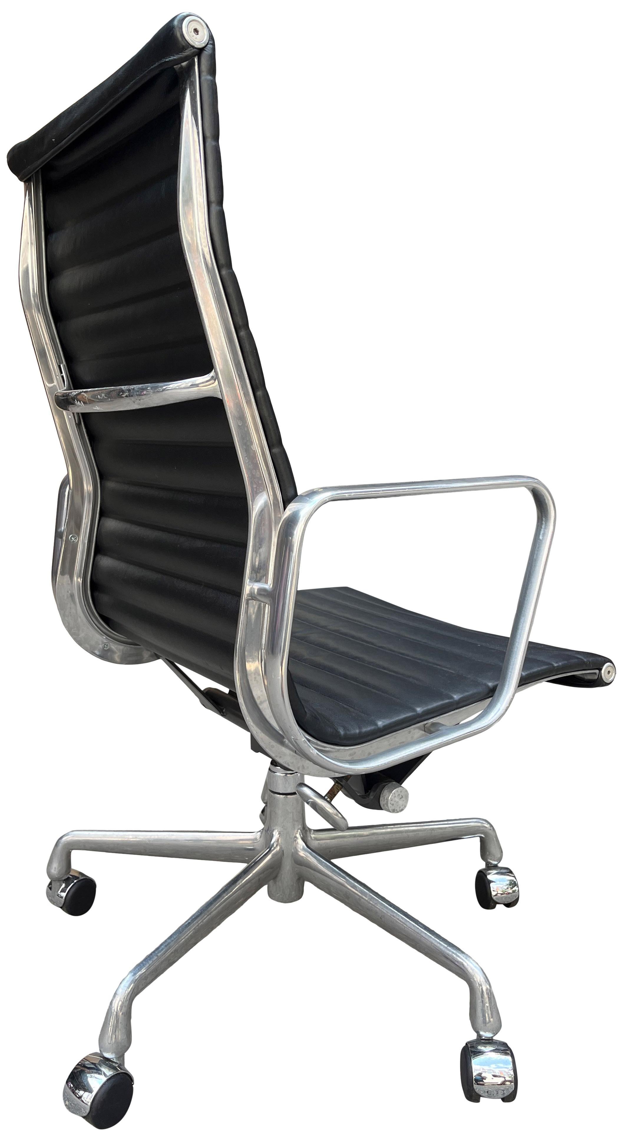 

Eames for Herman Miller Aluminum Group chairs in premium plush black leather with high-backs. 
An icon of Mid Century Modern design that continues to be produced today. Manual height and tilt. 50th anniversary addition premium black leather that