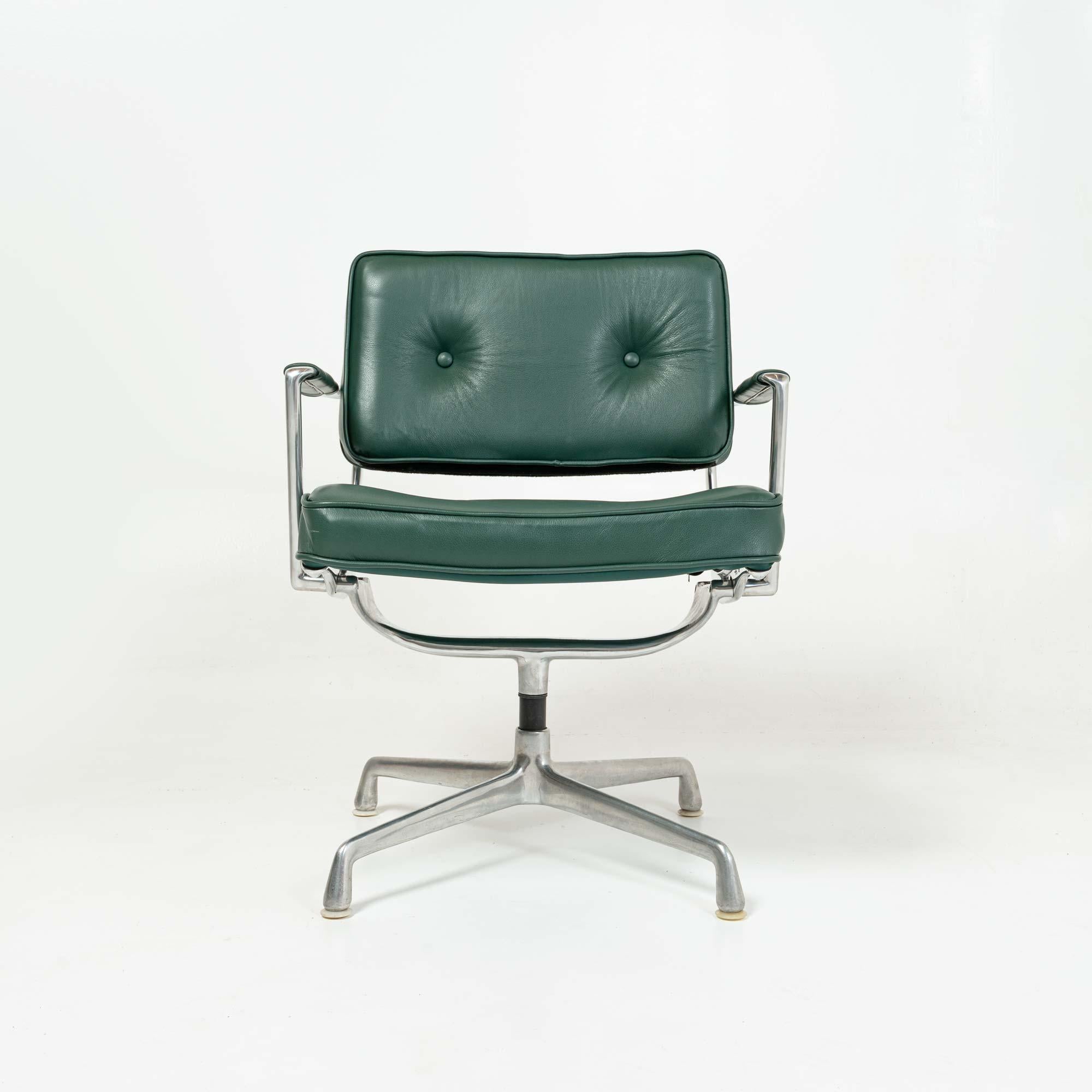 Eames Intermediate chair with arms version, early model, with white footglide reupholstered in British racing green leather.

Casters can be added per client request
    
