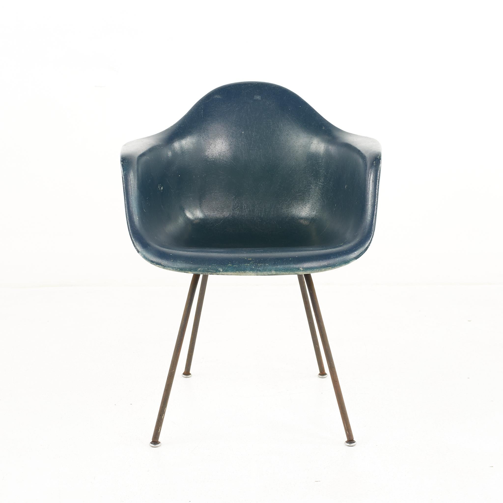 Eames for Herman Miller mid-century fiberglass green shell chair.

The chair measures: 24.75 wide x 22 deep x 31.25 high, with a seat height of 18 and arm height of 26 inches

All pieces of furniture can be had in what we call restored vintage