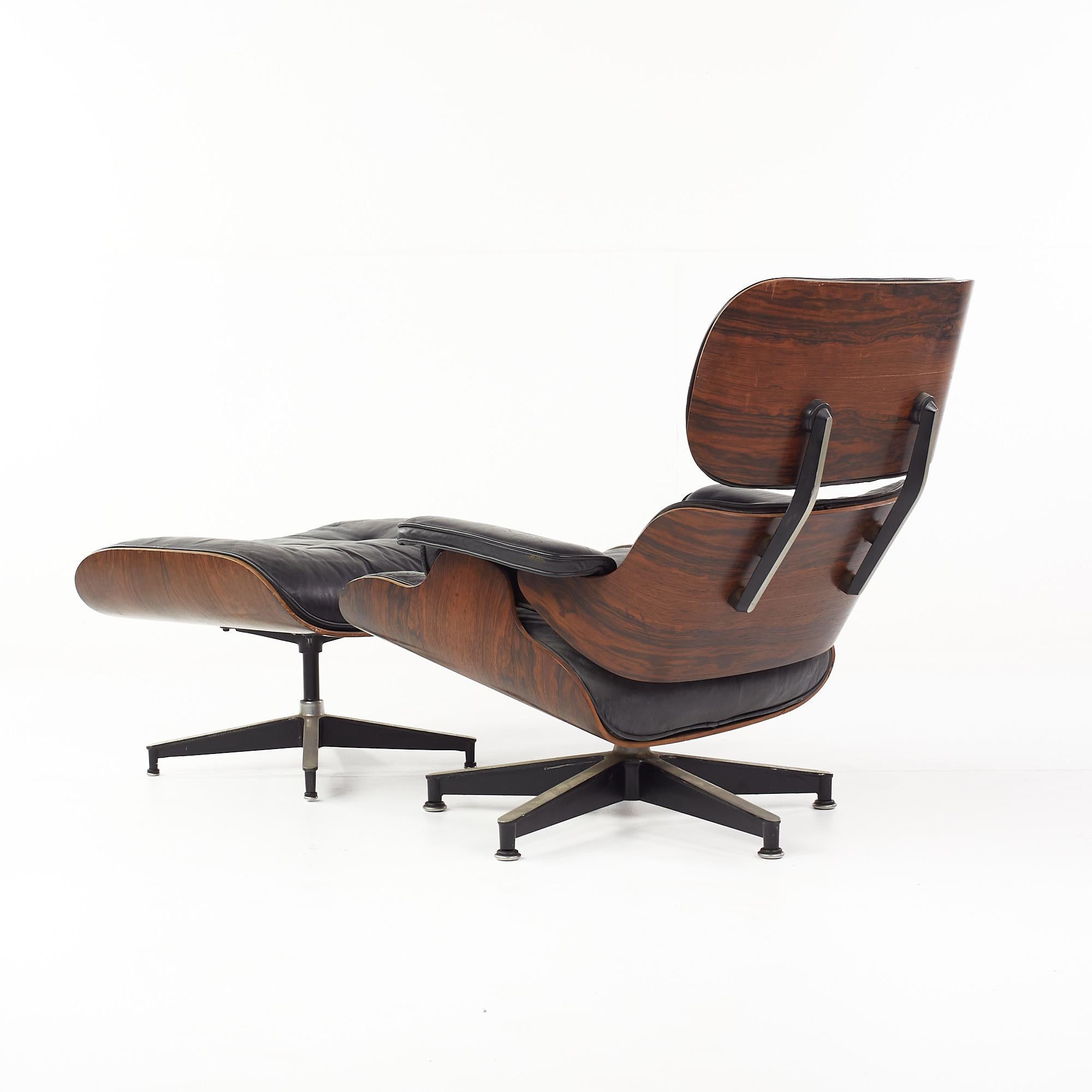 Late 20th Century Eames for Herman Miller Mid Century Rosewood Swivel Chair and Ottoman For Sale