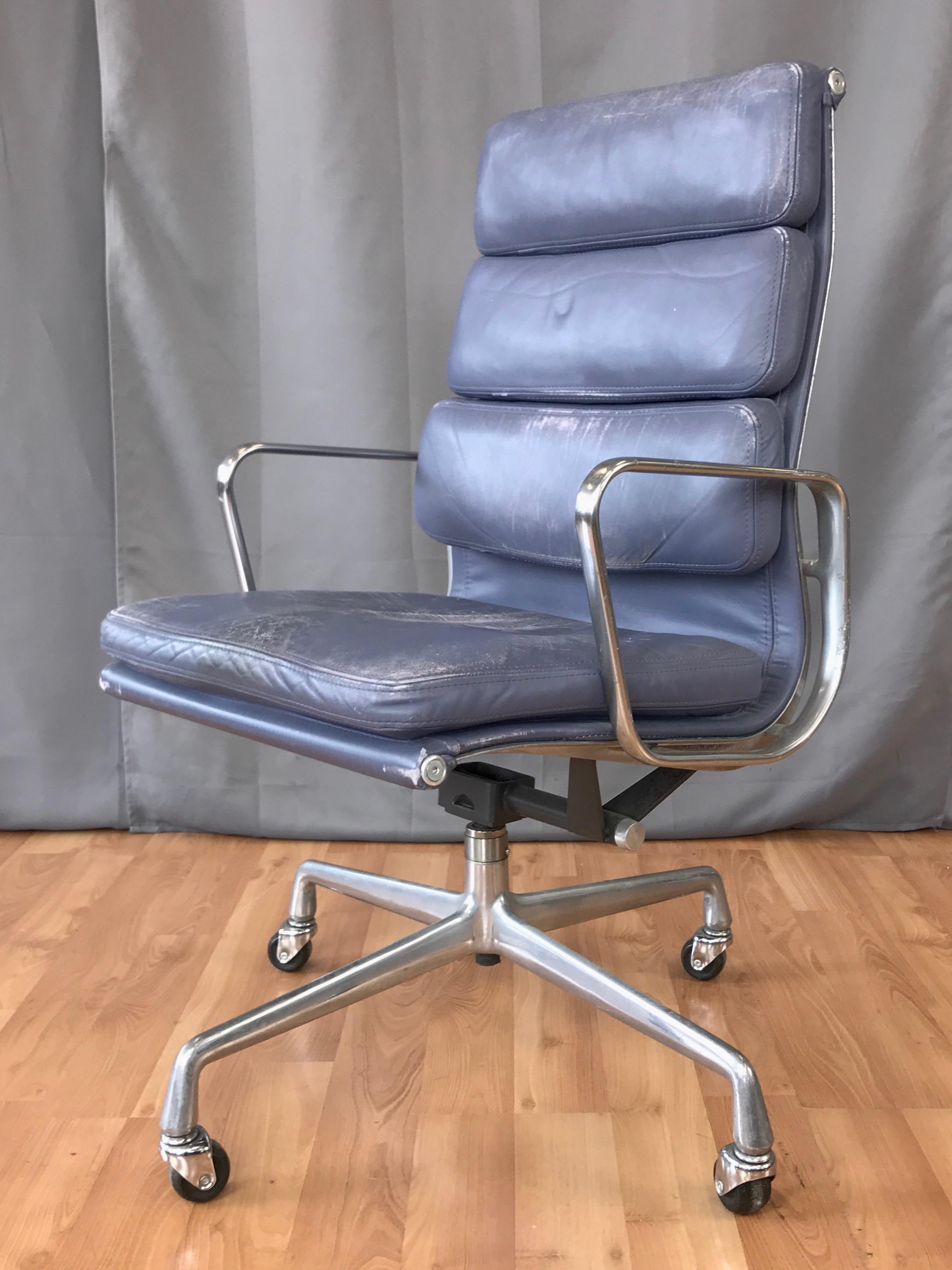 A leather Soft Pad Executive Chair by Charles and Ray Eames for Herman Miller, designed in 1969 and produced in 1985.

Shares the Eames Aluminum Group’s clean lines and timeless aesthetic, but with individual two-inch-thick cushions that enhance the