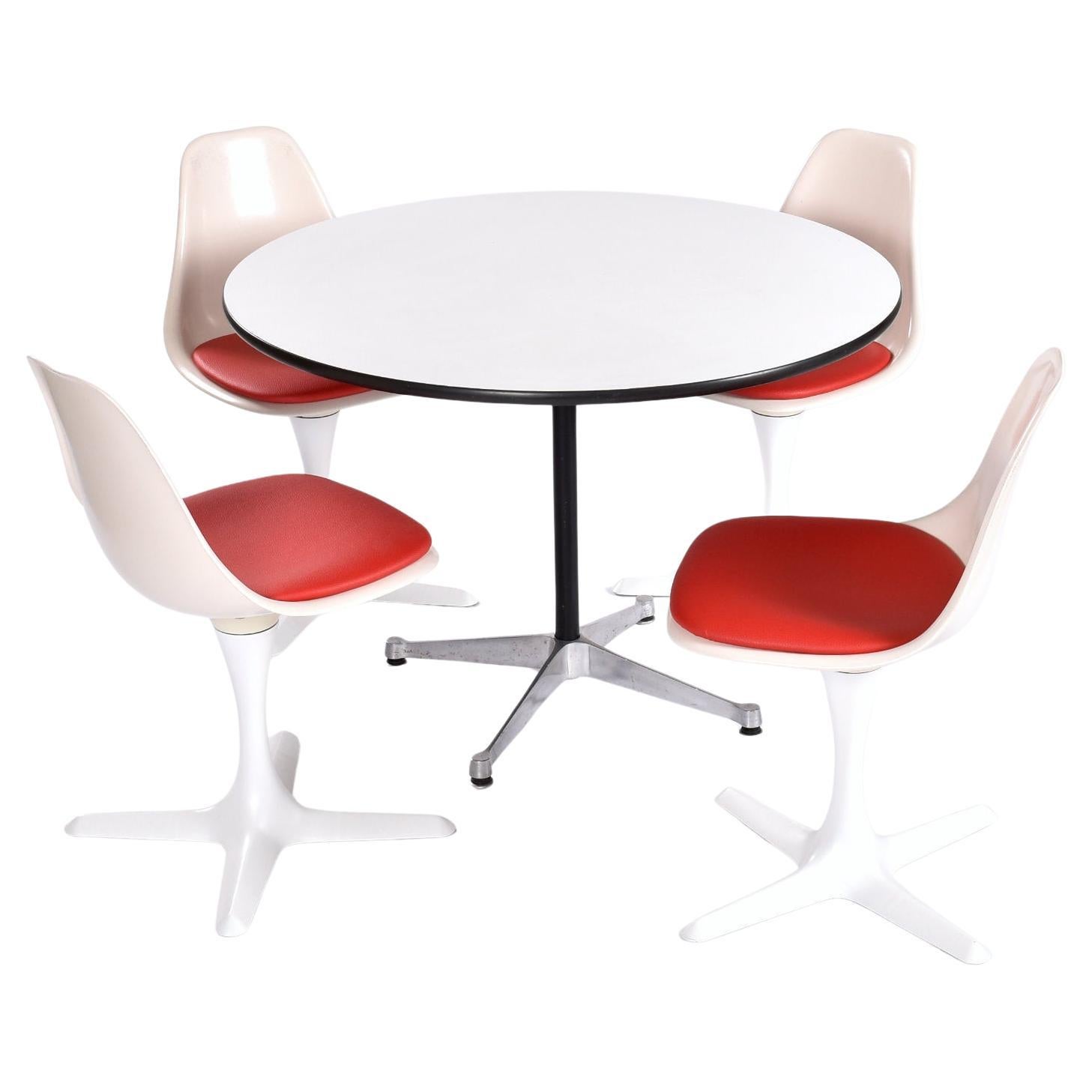 This listing is for the table alone. The chairs and accessories pictured are not included. 

Vintage Eames round white laminate table for Herman Miller. The 42″ diameter dining table rests on a classic Charles Eames aluminum contract base with black