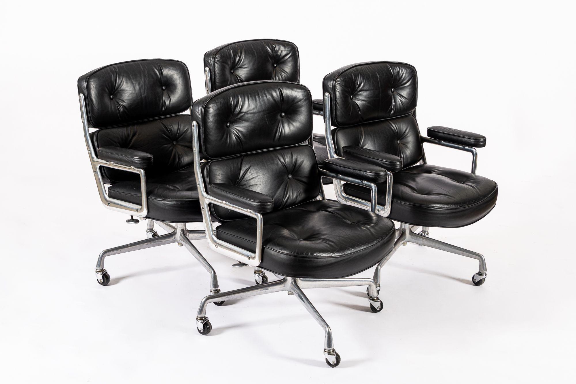 These vintage mid century modern black Model 3475 Eames Time Life Lobby Chairs designed by Charles & Ray Eames for Herman Miller were produced in the 1980s. This classic office chair features original black leather upholstery and four-star cast