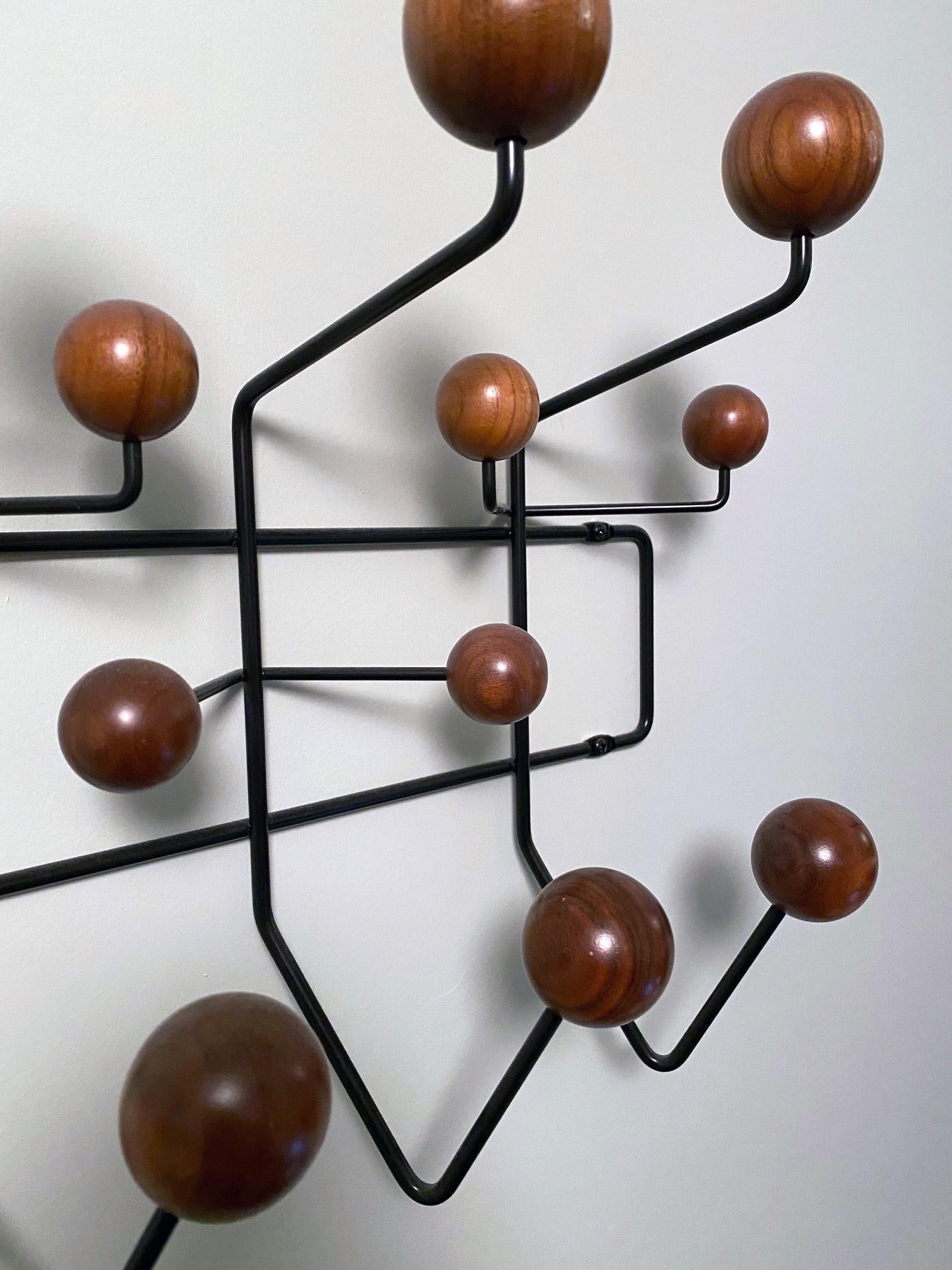 Charles and Ray Eames elevated the everyday coat rack into something fun. Originally offered with multicolored hooks and a white frame, we've added additional neutral color options to help it find a home in more places.

Eight large and six small