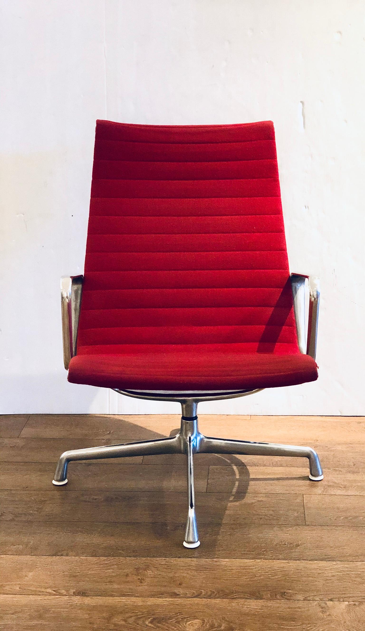 Eames Herman Miller aluminum group executive chair, in red fabric circa 1990s swivel to 360 degrees, very nice condition some worn on the red fabric as shown overall very clean. It does not recline.