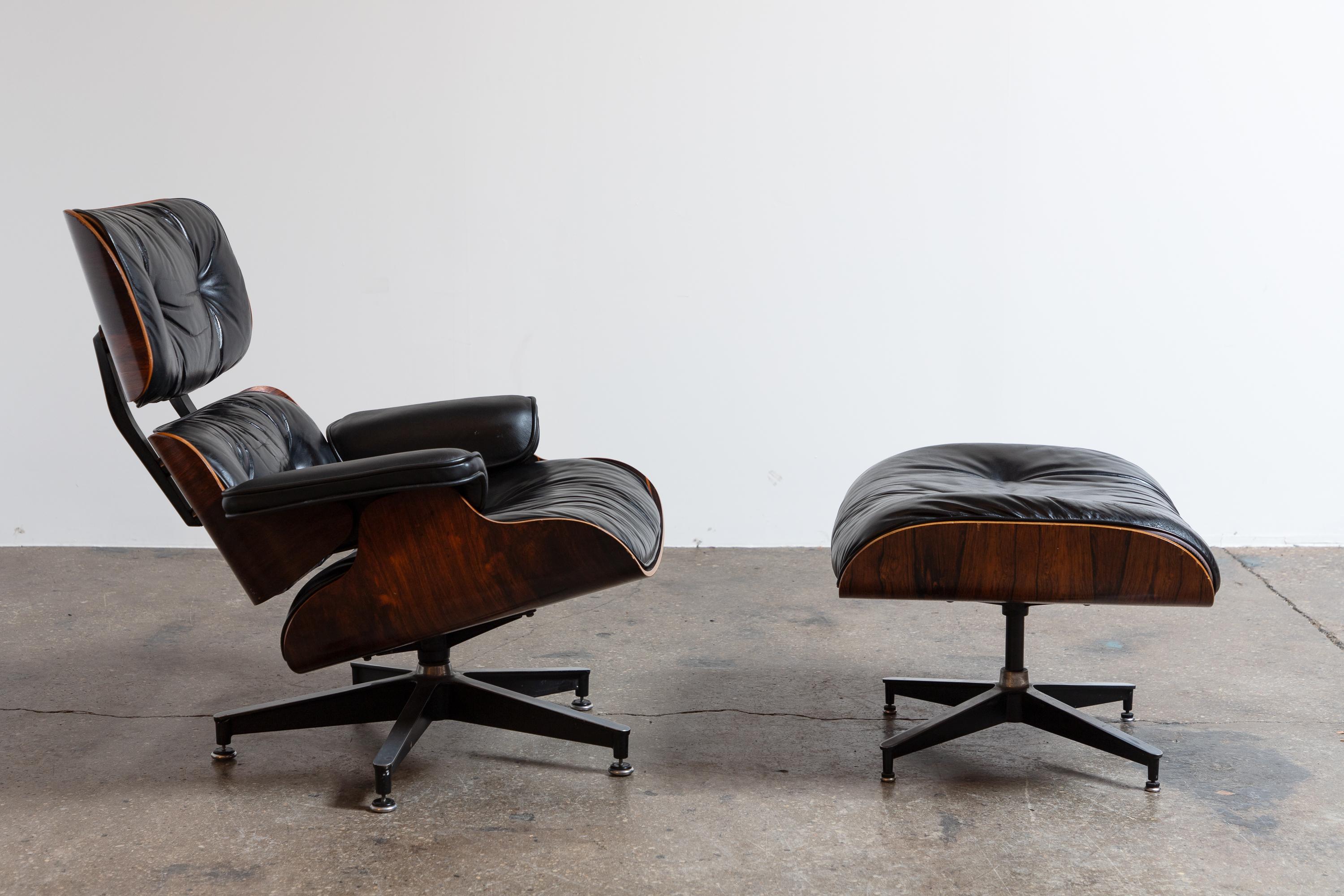 Iconic 670 lounge chair, paired with matching 671 ottoman, in Brazilian rosewood and black leather, designed by Charles and Ray Eames for Herman Miller. Gleaming frame showcases gorgeous rosewood veneer. Upholstery is in good condition, free of any