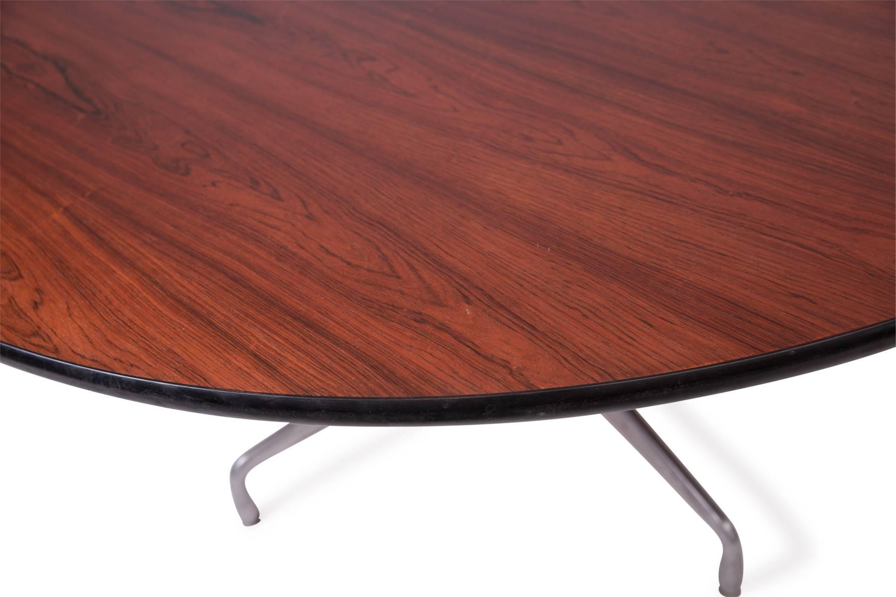 Charles and Ray Eames for Herman Miller rosewood dining table, circa mid-1960s. Beautifully grained Brazilian rosewood over the iconic Herman Miller base. Rare 60