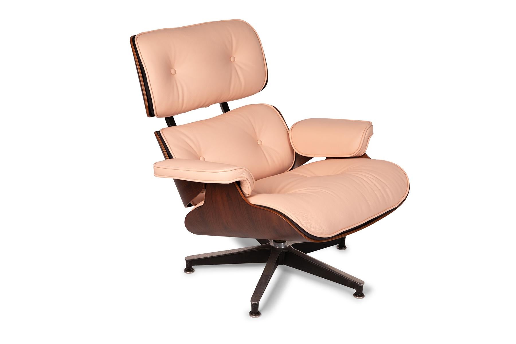 This Charles and Ray Eames for Herman Miller lounge chair and ottoman has beautifully grained rosewood shells and has been newly upholstered in a supple light pink leather. Price listed is for the chair and ottoman.