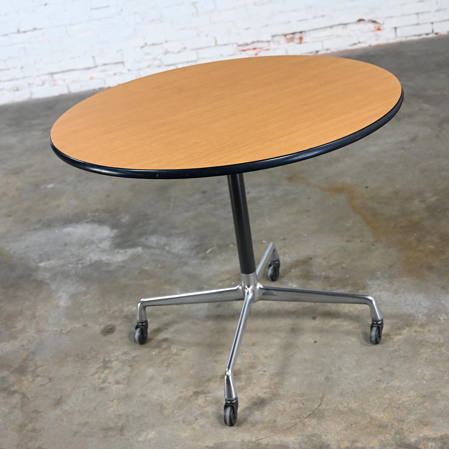 Mid-Century Modern Eames Herman Miller Round Table Universal Base Casters & 36” Blonde Laminate Top For Sale