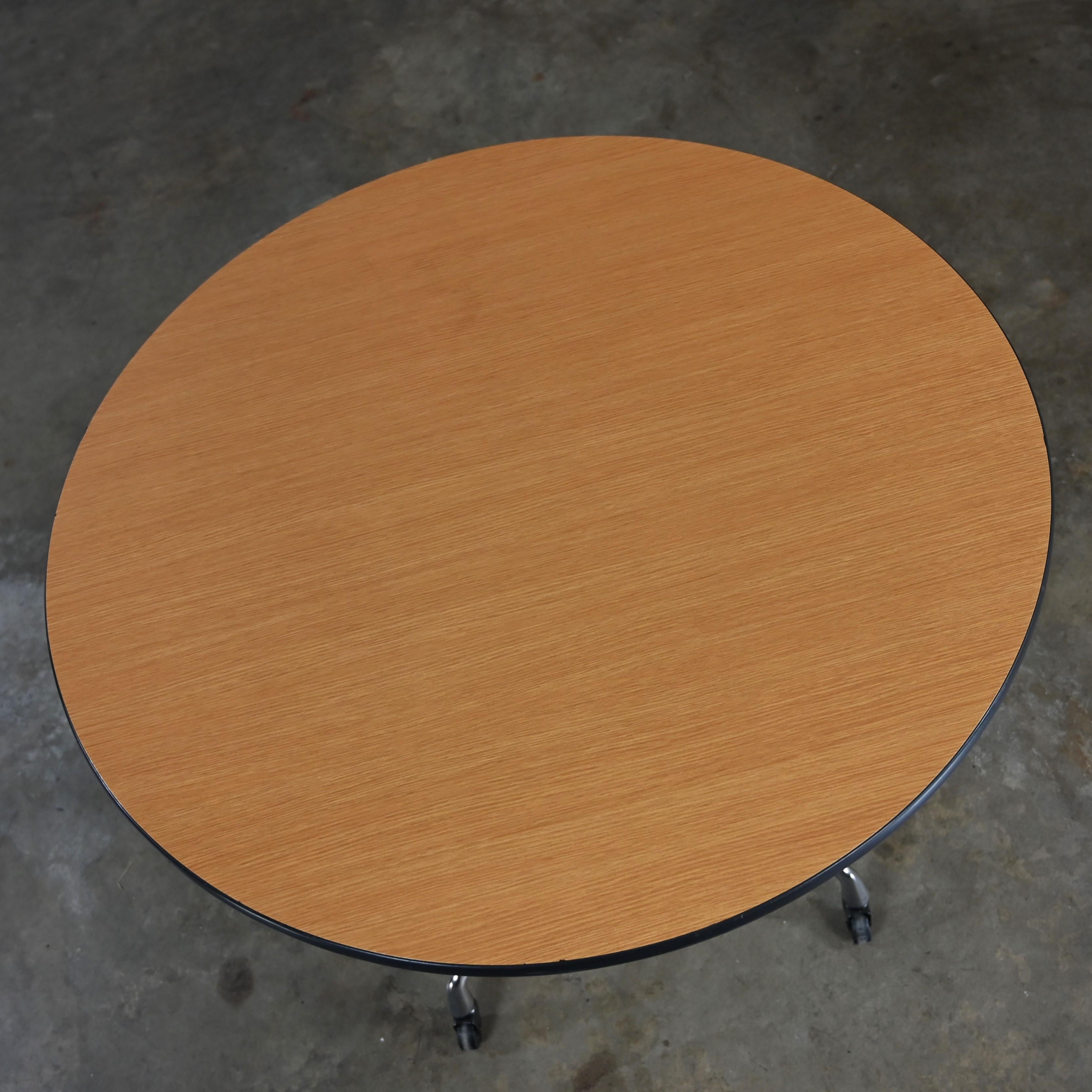 Aluminum Eames Herman Miller Round Table Universal Base Casters & 36” Blonde Laminate Top For Sale