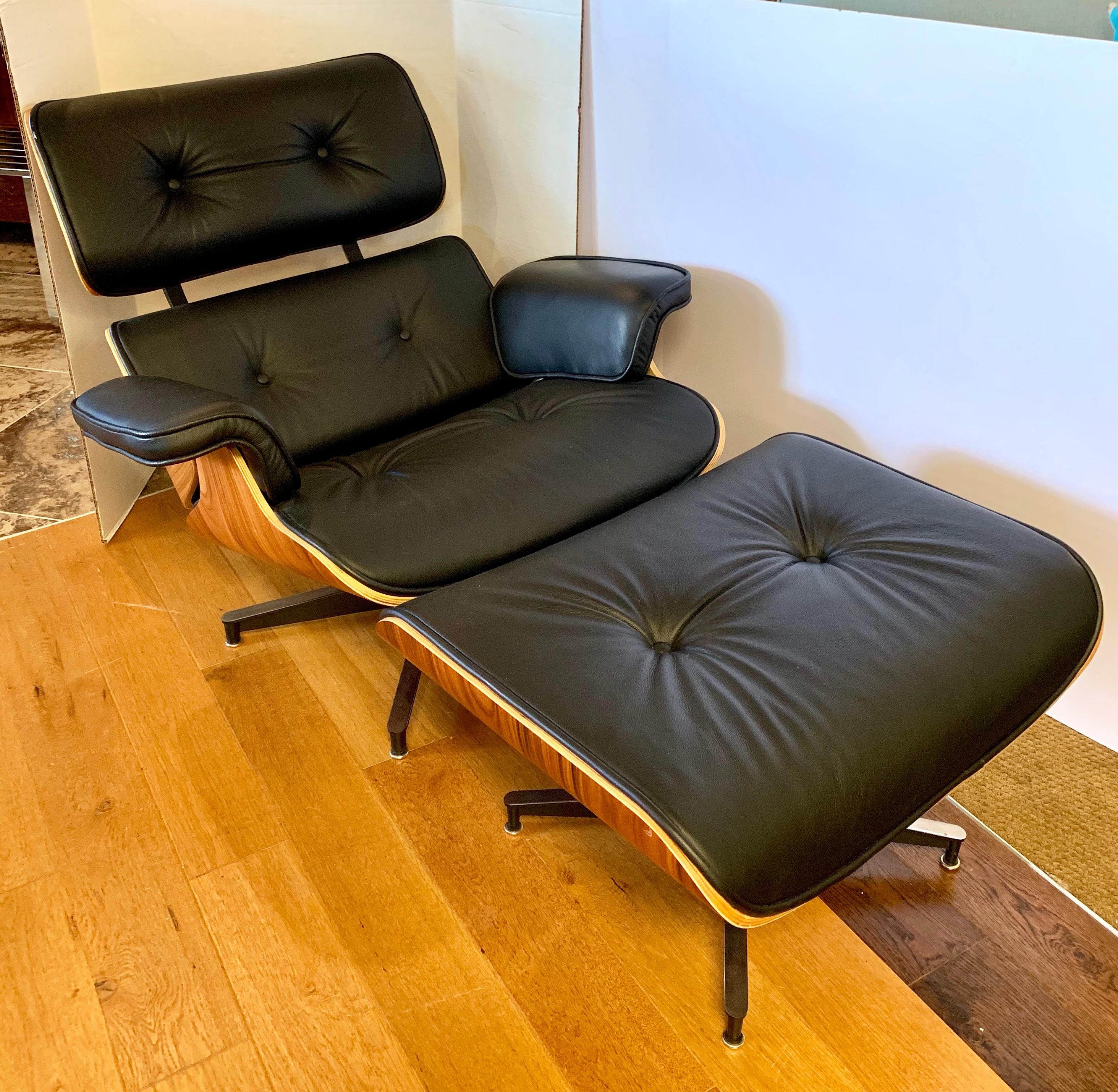 Well made recent reproduction of the iconic Herman Miller chair in ottoman. Leather is real, soft and the highest quality. Condition is excellent. There are no signatures.