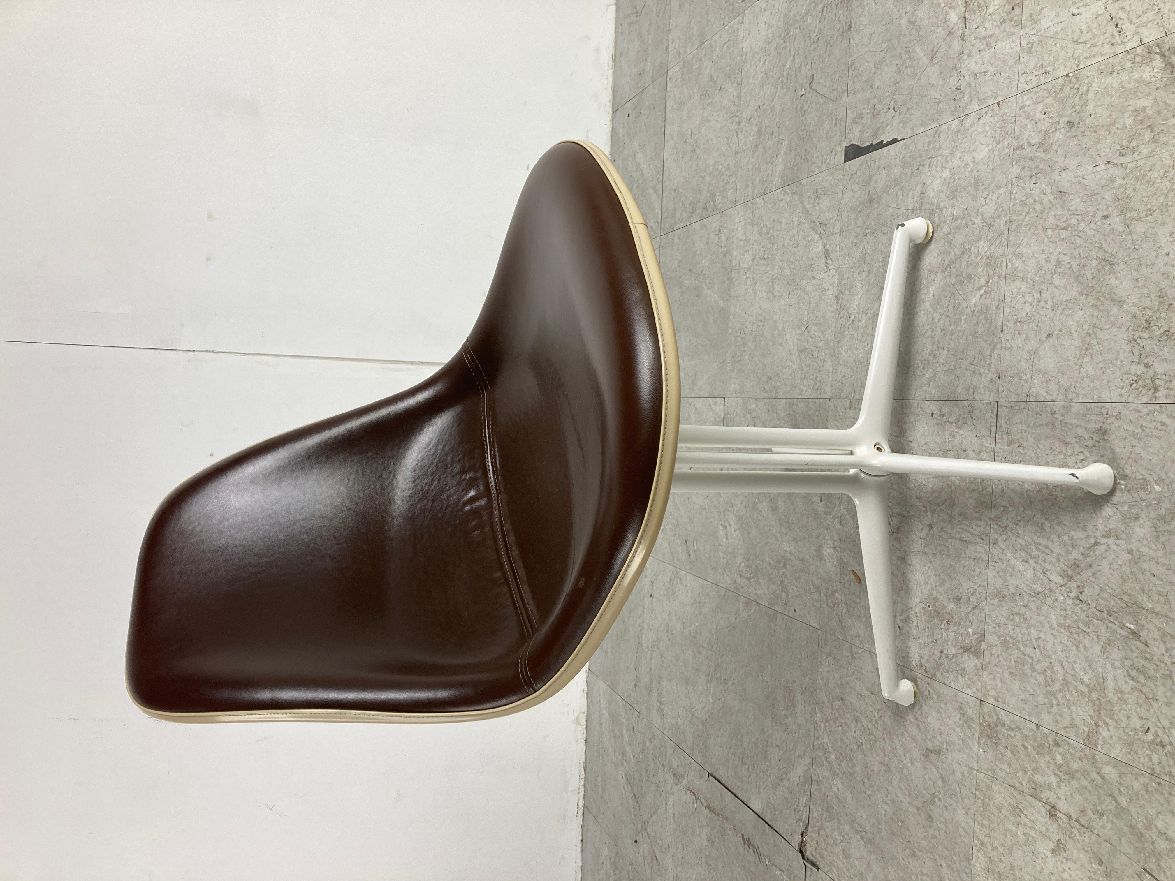 Mid century fiberglass and leatherette 'La fonda' chairs designed by Charles and Ray Eames and produced by Herman Miller.

White lacquered metal base. 

White and brown combines beautifully.

Nice set of 8 which you dont see so often.