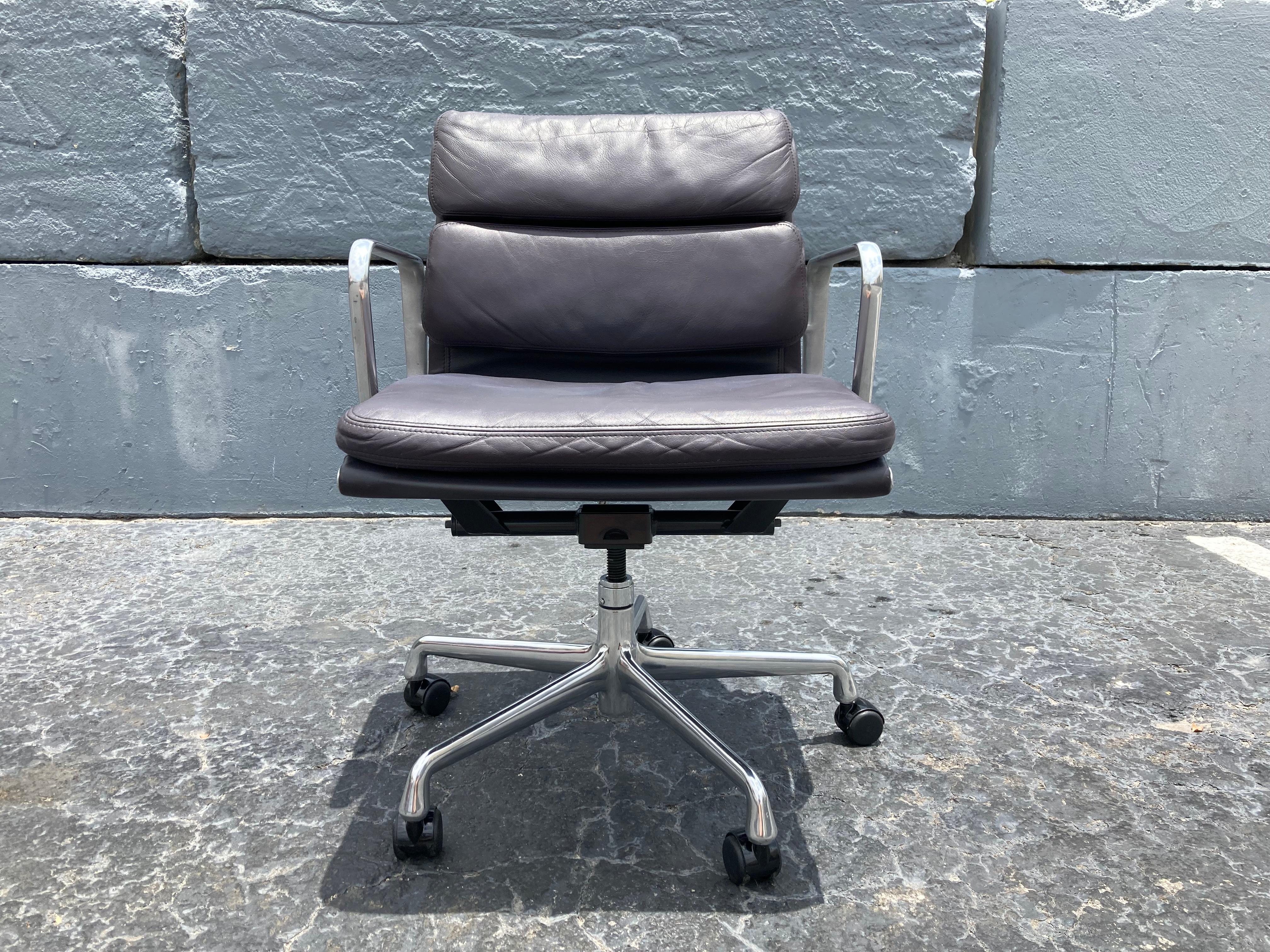 Beautiful Eames soft pad chair for Herman Miller.
Chair has a rare dark aubergine color leather, swivels, tilts and on casters.
Measures: Seat height is adjustable 19.75”, 22.50”.