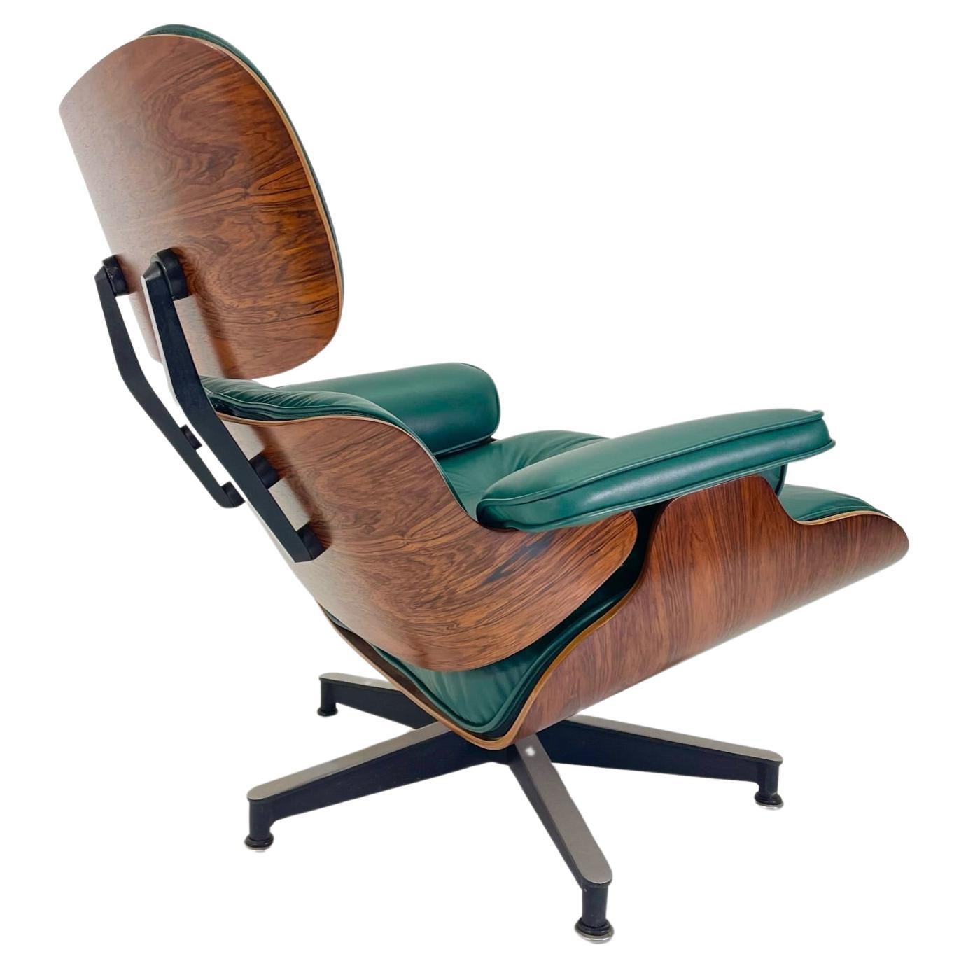 Just arrived! This incredible chair has been restored with refinished rosewood shells, new shock mounts, and brand new hunter green leather and down filled cushions. We love how the hunter green cushions make the deep rich rosewood pop. This is a