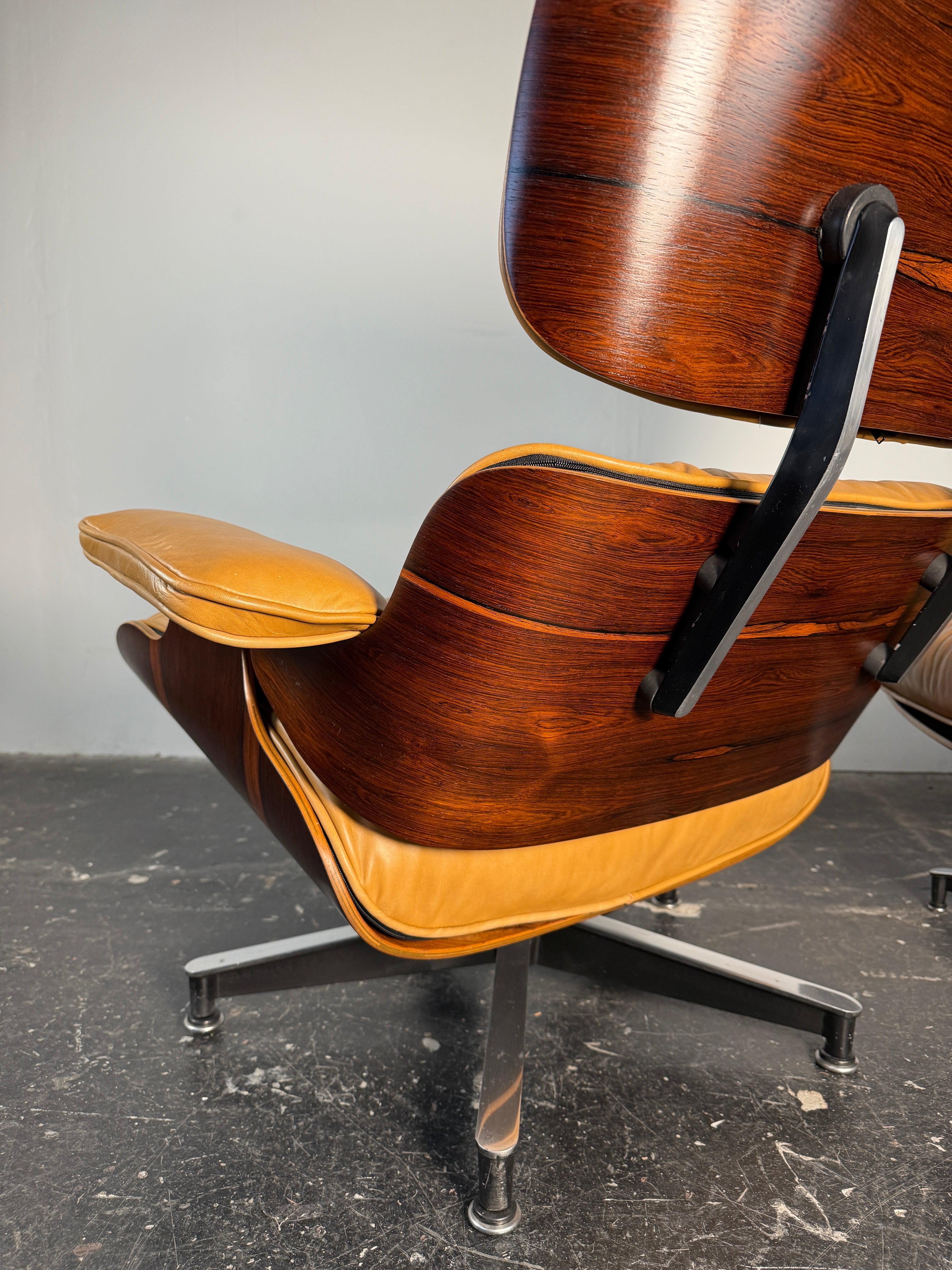 Just arrived! This incredible chair has been restored with refinished rosewood shells, new shock mounts, and brand new leather and down-filled cushions. We love how the warm butterscotch colored leather cushions make the deep rich rosewood pop. This