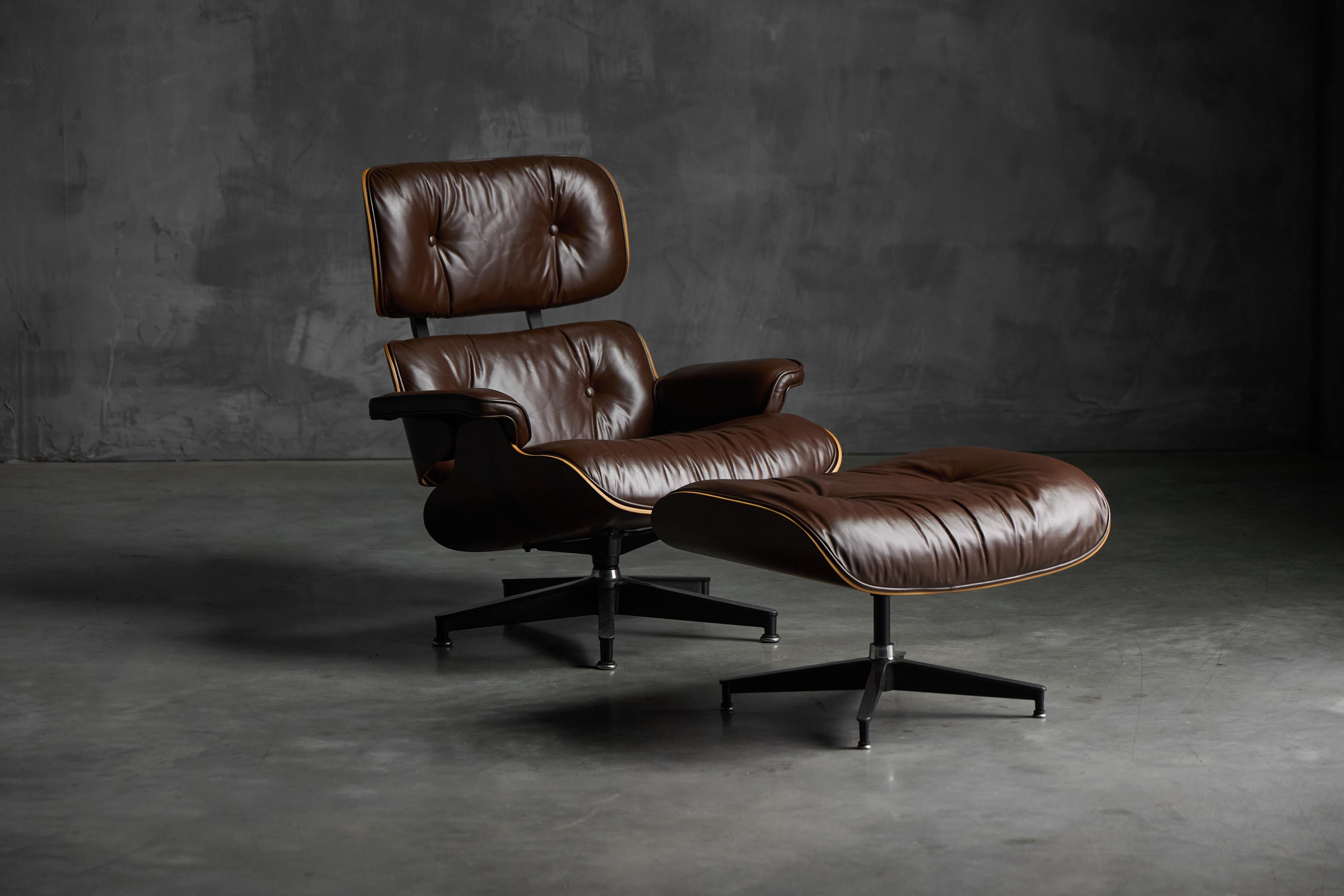 This 4th generation Eames Lounge Chair with matching ottoman, produced by Herman Miller between 1974 and 1991, is a striking example finished in chocolate-brown leather and the highly prized Rio Palisander veneer (Dalbergia nigra). Designed by