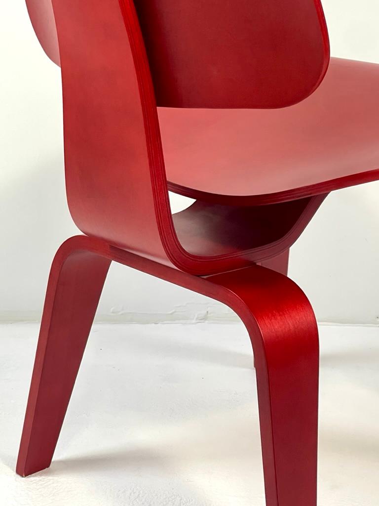 American Eames Molded Plywood Dining Chair Wood Base (DCW) in Red Stained Birch excellent For Sale