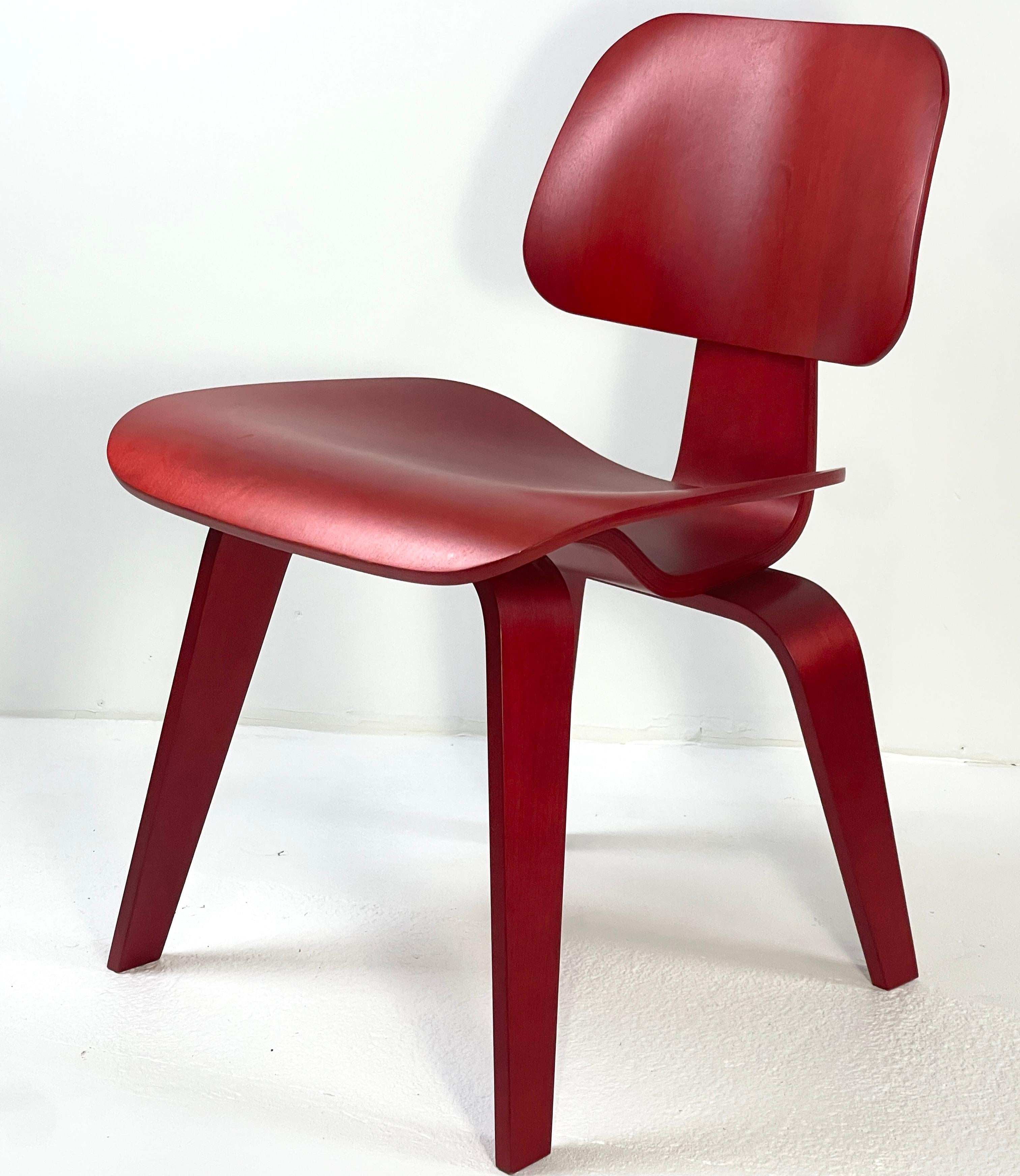 Contemporary Eames Molded Plywood Dining Chair Wood Base (DCW) in Red Stained Birch excellent For Sale