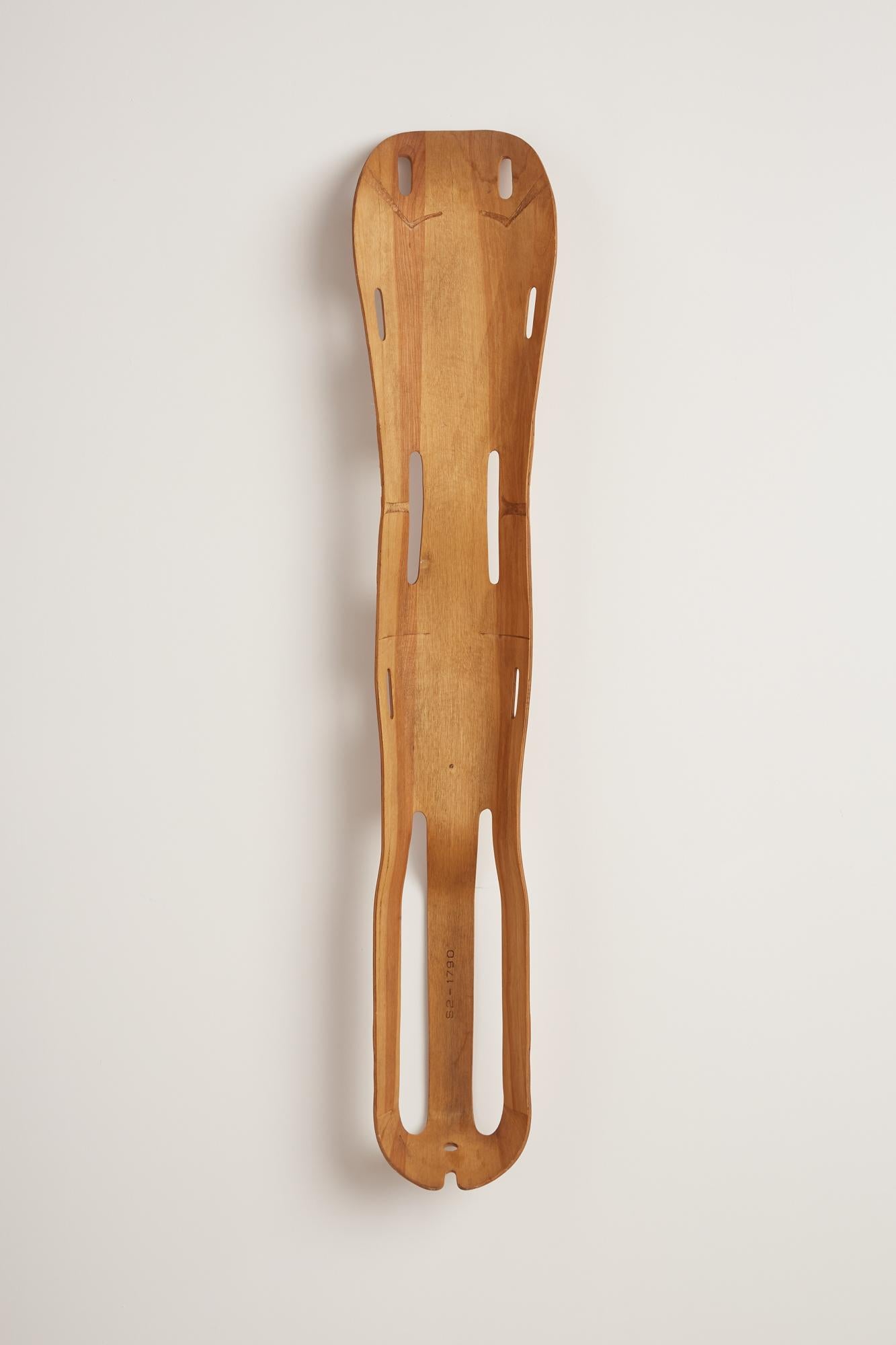 Molded plywood leg splint designed by Charles and Ray Eames for Evans Products c. 1940s. This piece was commissioned by the Navy during World War II for injured soldiers. This sculptural yet functional device helped to perfect the molded plywood
