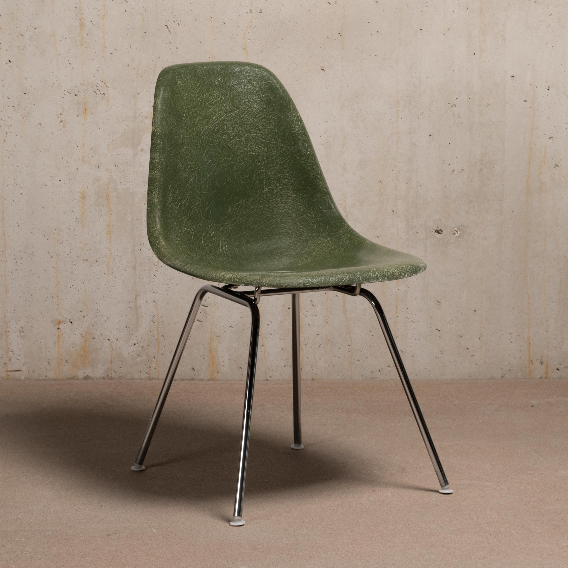 Iconic DSX chair designed by Charles and Ray Eames for Herman Miller International Collection (Vitra). Molded fibreglass shells in the colour Olive Green Dark with chrome plated steel H-bases. All in very good original condition with only minor