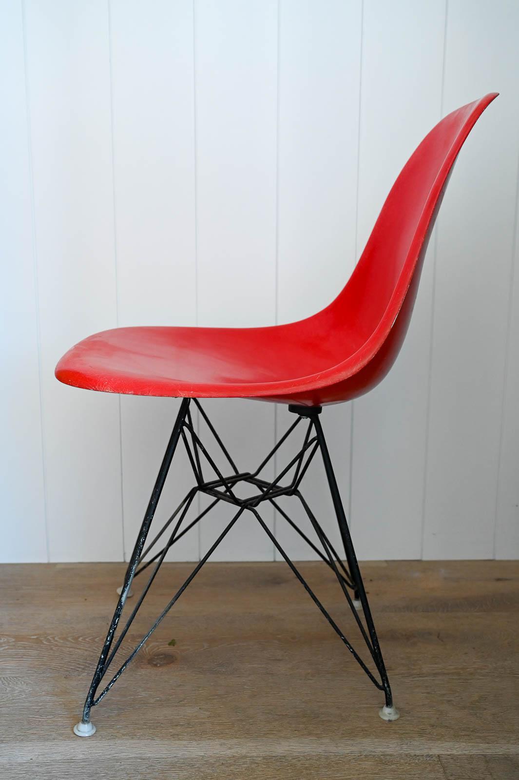 Eames Red Fiberglass DSR for Herman Miller, ca. 1970.   Beautiful rare red fiberglass Zenith shell with black Eiffel Tower Base.  All original and still retains floor guides.  Very good original condition with no cracks to fiberglass, only slight