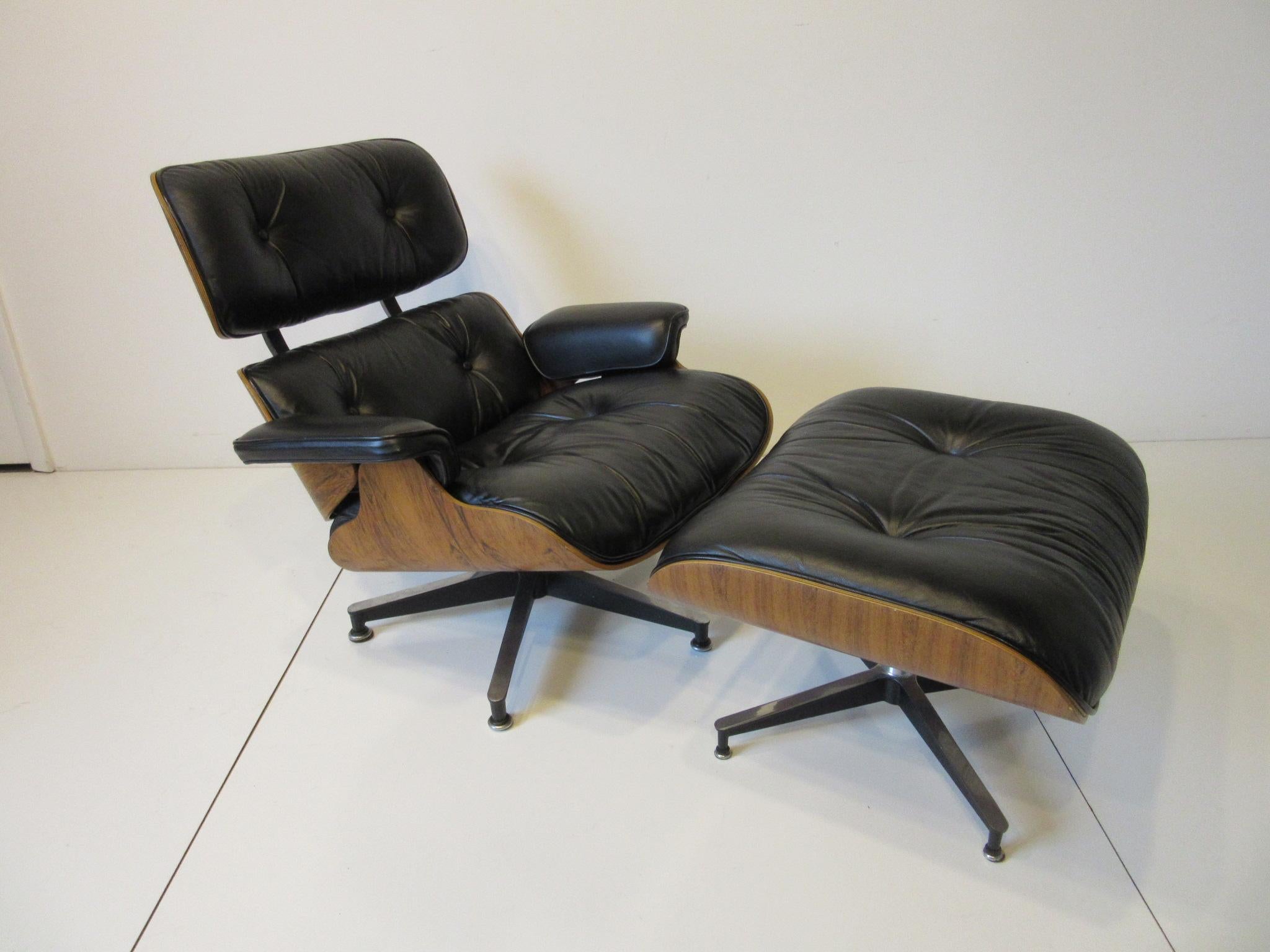 A soft black leather 670 lounge chair and matching 671 ottoman having a beautiful well grained Brazilian rosewood shell. This midcentury iconic piece retains the manufactures label from the Herman Miller Furniture Company and was purchased from the