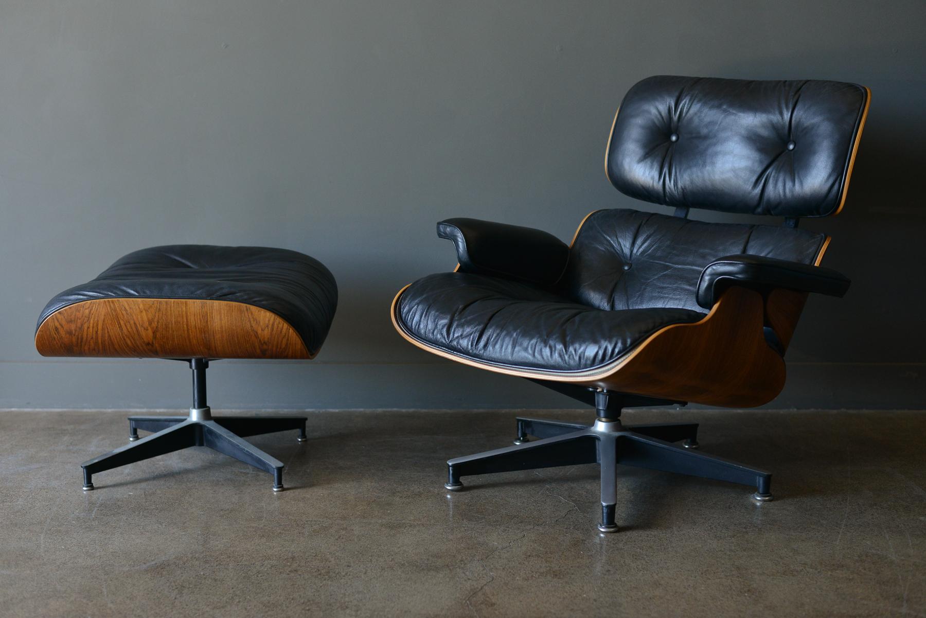 Eames rosewood lounge chair and ottoman, circa 1971. Original Charles Eames 670 and 671 lounge chair and ottoman for Herman Miller in black leather and rosewood. Beautiful patina to the leather, original 5 star base with domes of silence floor