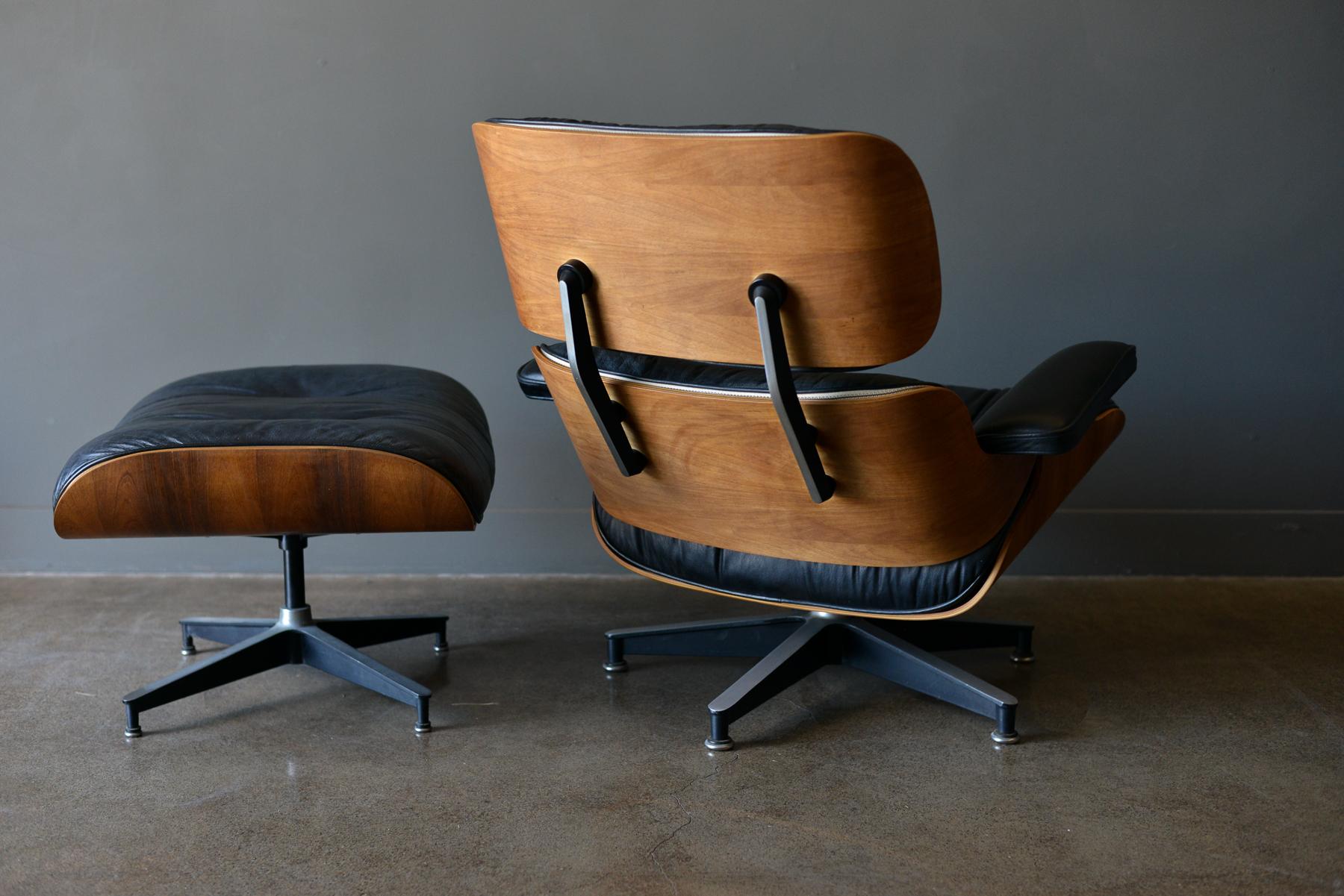 Eames rosewood lounge chair and ottoman, circa 1971. Original Charles Eames 670 and 671 lounge chair and ottoman for Herman Miller in black leather and rosewood. Beautiful patina to the leather, original 5 star base with domes of silence floor