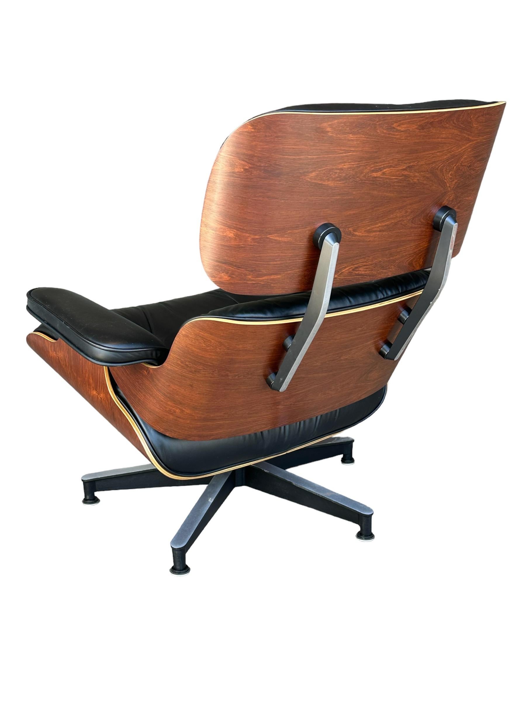 Classic, iconic, beautiful. Does t get better than an Eames lounge chair, unlike newer models which feature less attractive materials this is executed in black leather and refinished Brazilian rosewood shell, which are even in color and feature