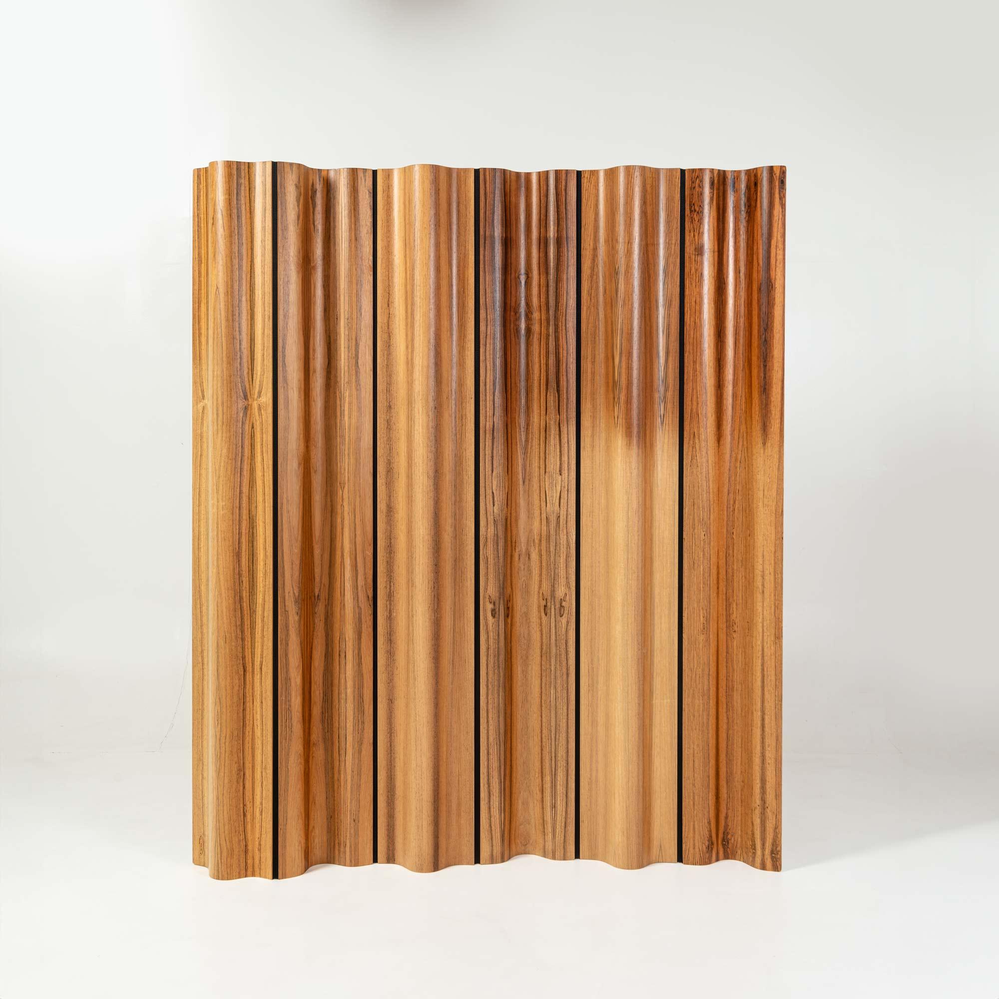 Limited edition of the Eames folding screen (FSW-6) in rosewood, numbered 322/500. The design of the screen was a clever combination of molded plywood panels and a flexible cotton canvas band in between each. The panels were shaped to the same exact