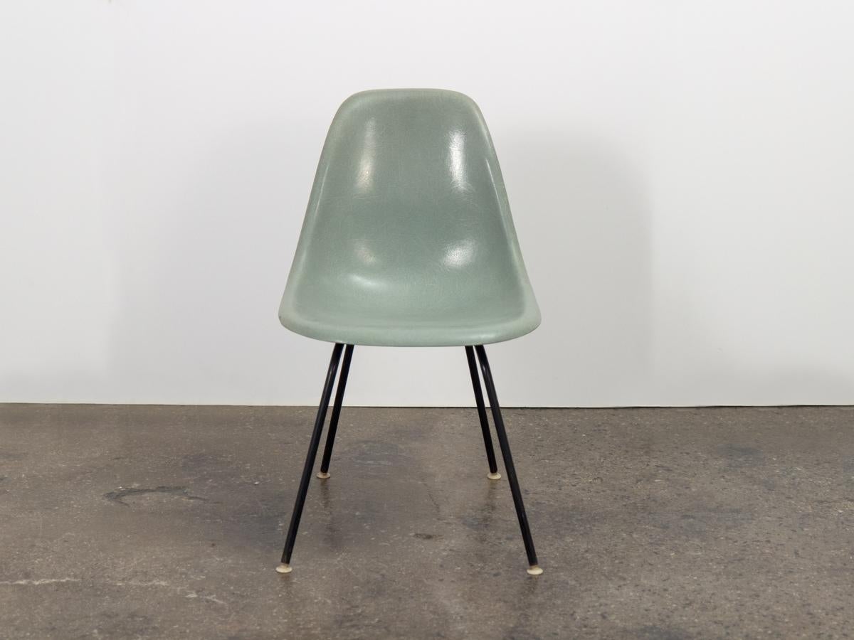 Scarce Seafoam fiberglass shell by Charles and Ray Eames for Herman Miller. This 1950s shell chairs is particularly coveted for its rarity and attractive hue. In beautiful vintage condition, with distinct thread and minimal wear. Marked on the
