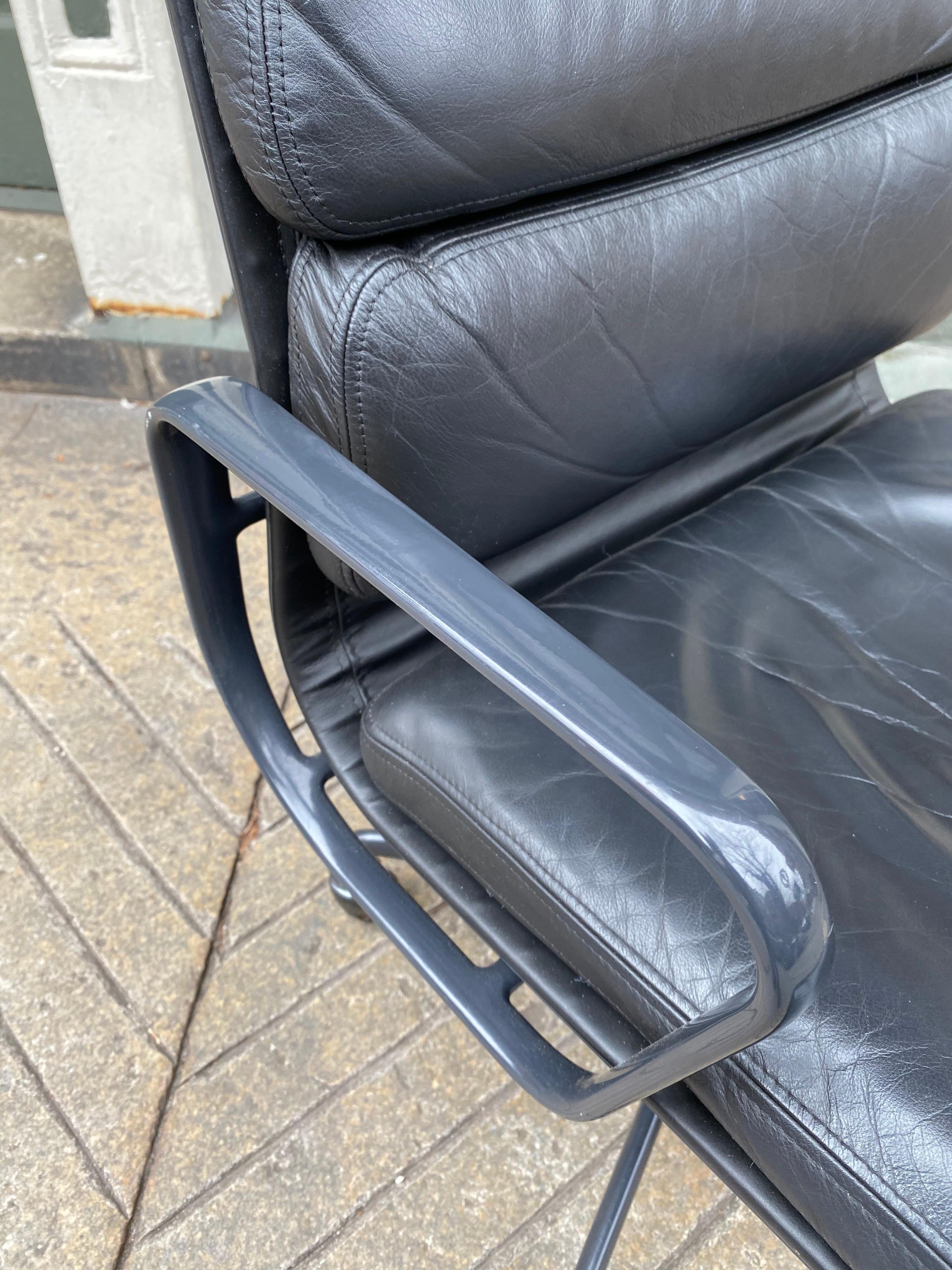 Eames for Herman Miller executive soft pad black leather desk chair. Overall very good shape with a couple flaws to paint on arms and corners of leather. Sits great! Very comfortable chair that has both style and Classic midcentury looks! Arms and