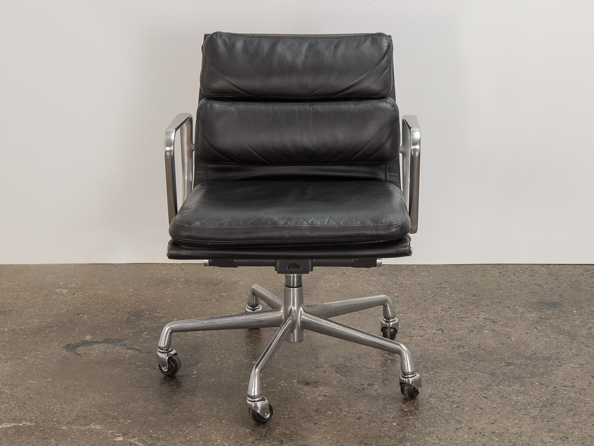 Vintage soft pad management swivel chair in black leather, designed by Charles and Ray Eames for Herman Miller. The ultimate desk chair that delivers function and comfort. Known for their seat cushions, our vintage example is incredibly plush is