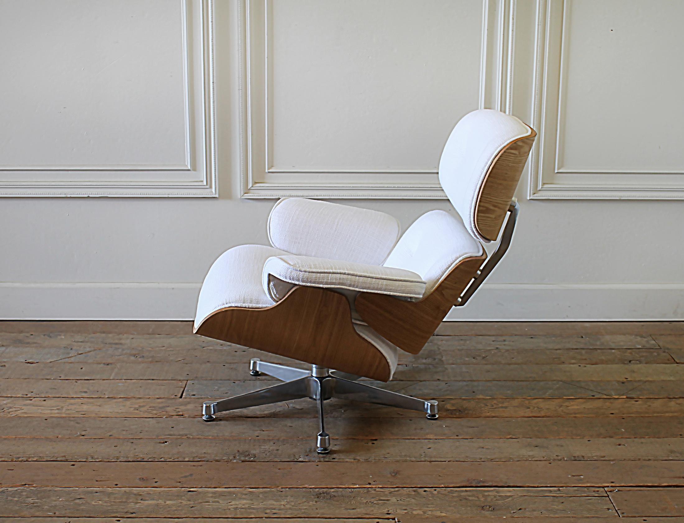 North American Eames Style Chair and Ottoman in Coated White Linen Blend Upholstery